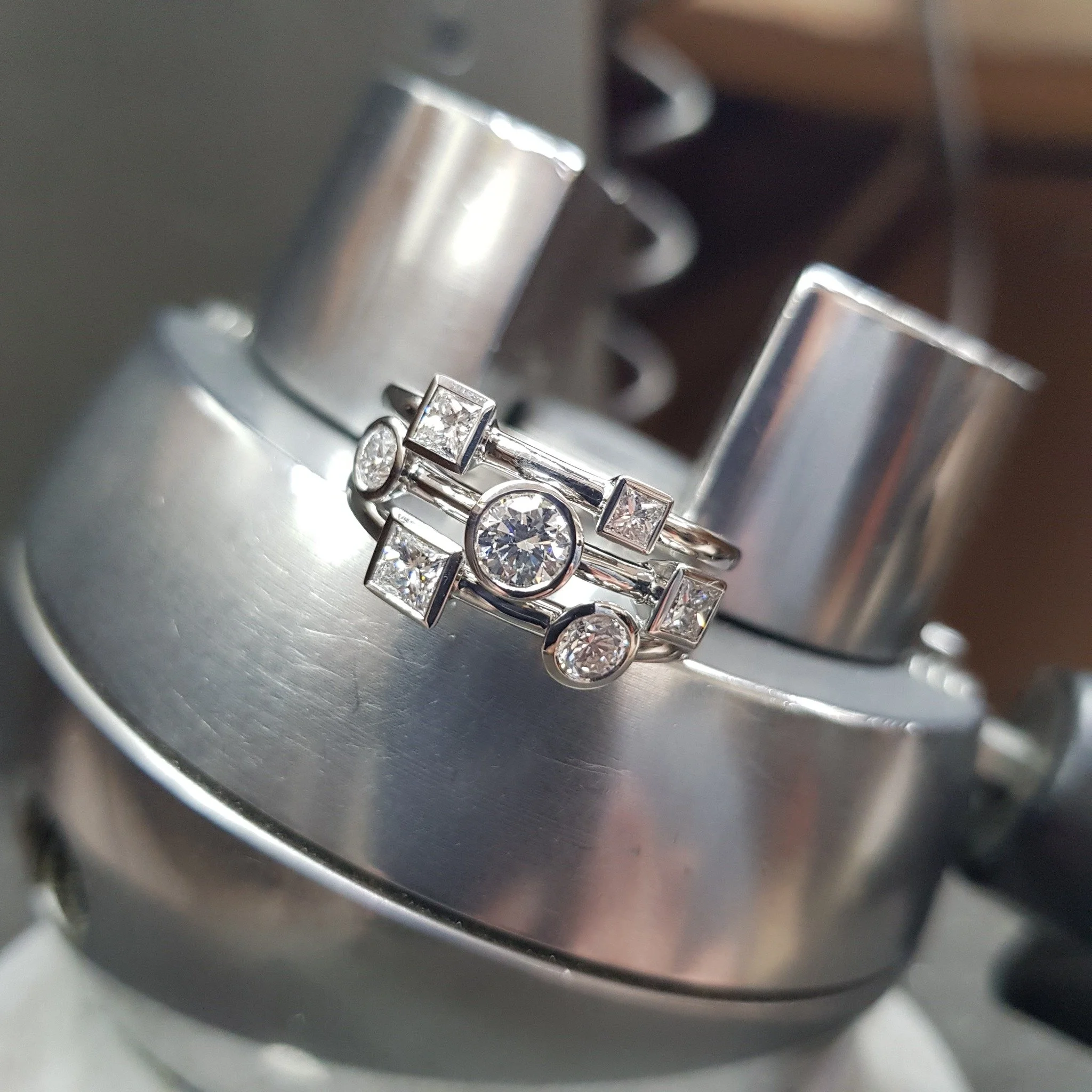 Always one of our absolute favourites - the Twilight ring is back on the shelf in Platinum this time.  Set with seven round brilliant and princess cut stones, it's a remarkably comfortable (and sparkly) ring to wear.

#independentjeweller #designerje