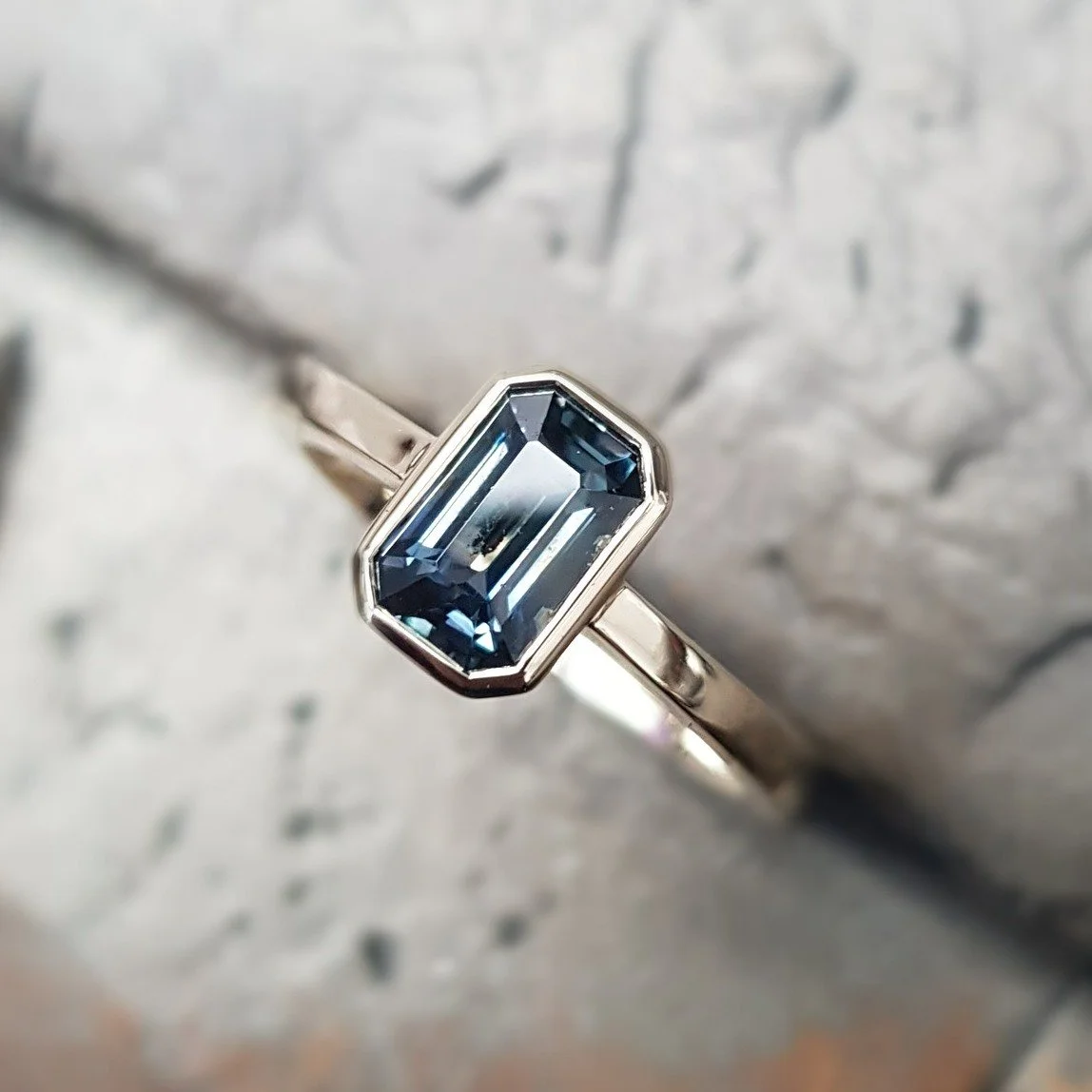 There's a real love for Teal Sapphires at the moment and we were totally taken by the cut and depth of colour of this one. 

We've set it into a 9ct yellow gold full bezel to add a level of richness and draw the eye into the shape of the stone. It's 