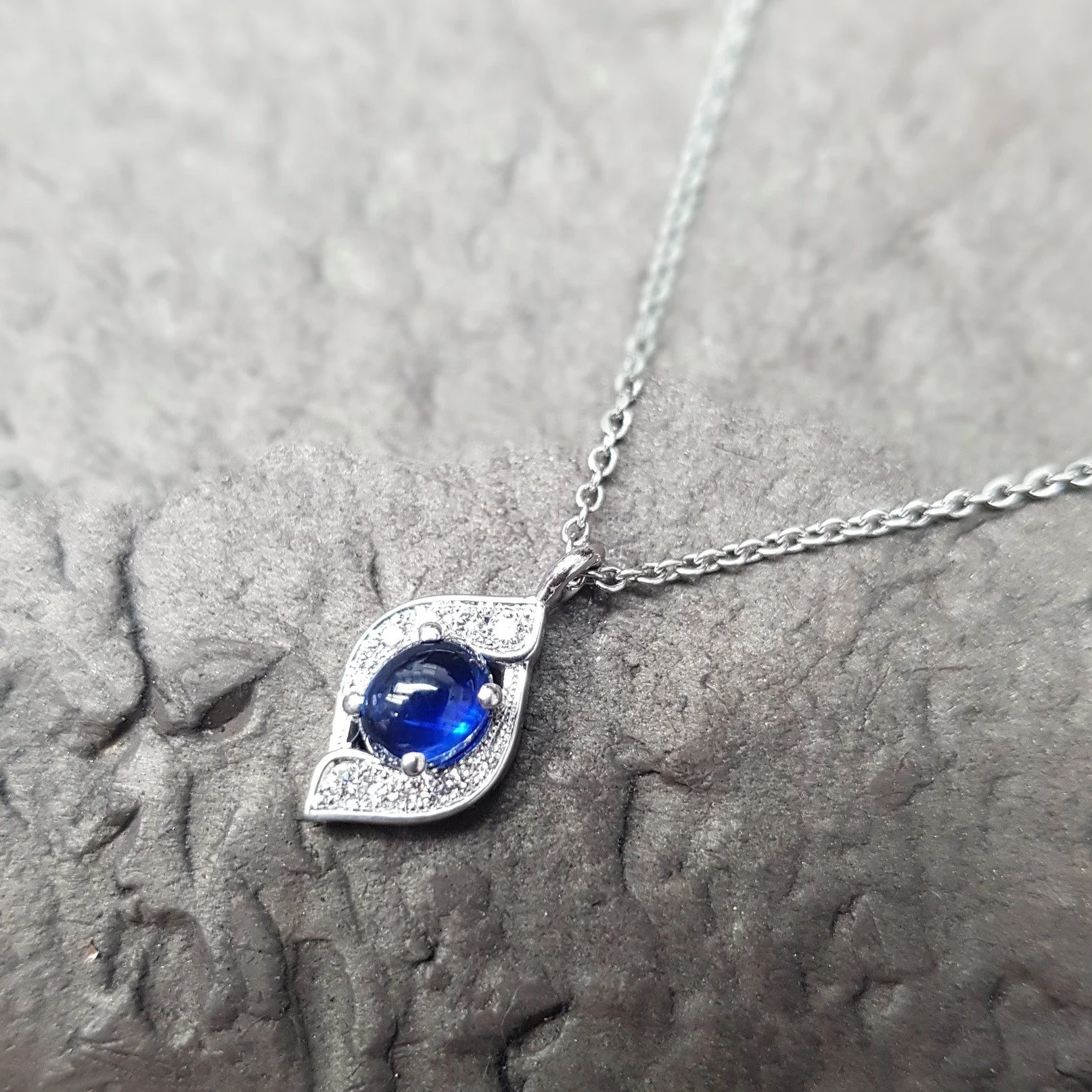 The first of our archive collection showcasing unique 'last chance to buy' pieces. This is Embrace - a swathe of diamonds circling around one off stones.  Featured here are a cabochon sapphire and a brilliant cut ruby - keep your eyes out for the fin