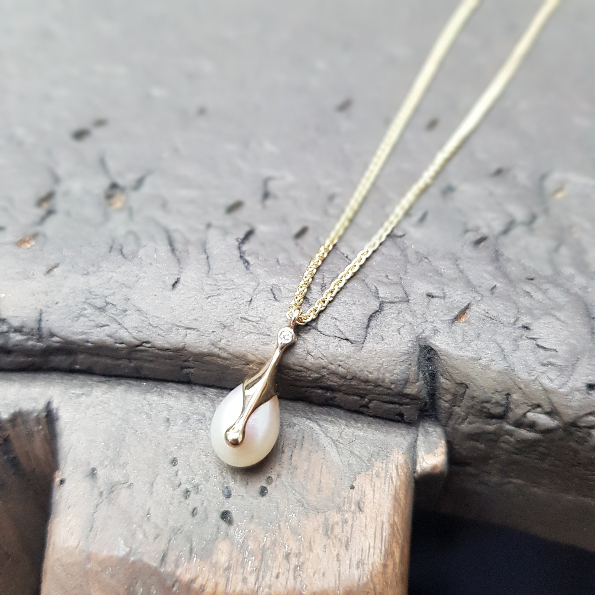 Matching in with our new Molten Drip Pearl Drop Earrings (see our grid from a few days back), we've set the companion pendant with a diamond at the top to elongate and draw the eye. This one's in 9ct yellow gold with a lovely warm cream coloured pear