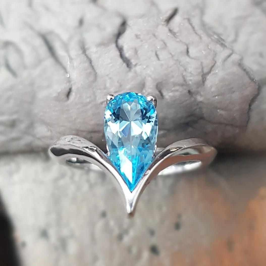 Part of our Satellite family, this wishbone ring is set with an elongated pear shaped swiss blue topaz in 18ct white gold. It's a dramatic piece that sits really comfortably on the finger.

Satellite Wishbone Ring &pound;766. Call, pop in or DM for m