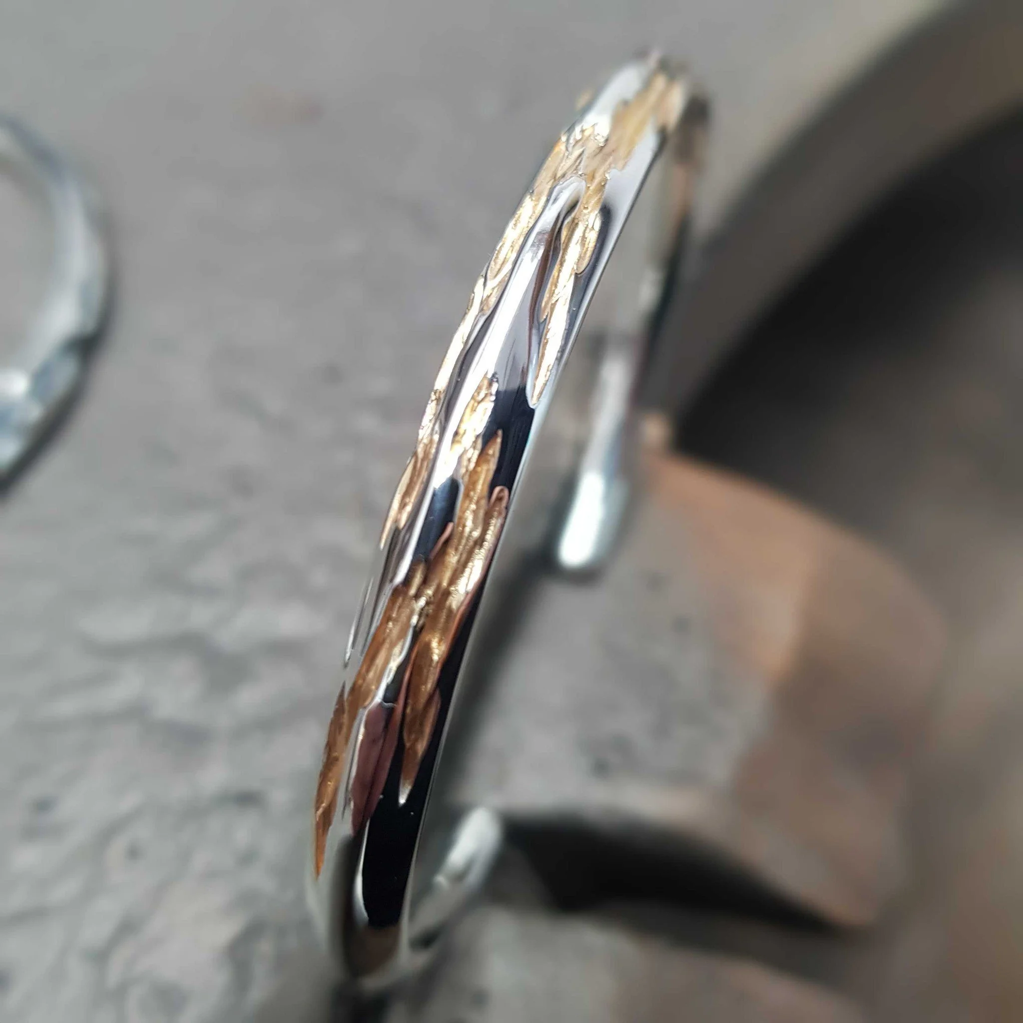 One of our newer collections, Ember has a wonderful, deep, textured finish, which can be enhanced by oxidising or by adding gold - creating a beautiful dual colour bangle. Remember, our bangles can all be adjusted to fit your wrist properly incase yo