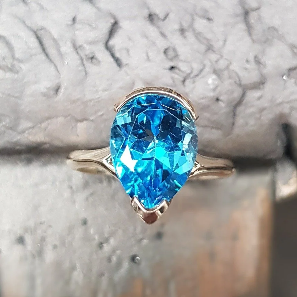 We've loved these pear shaped bubble rings this year - and the workshop have just managed to sneak one extra out for us - this time in 9ct yellow gold, set with a remarkable swiss blue topaz pear shaped stone, which I'd happily dive into.  Really sur