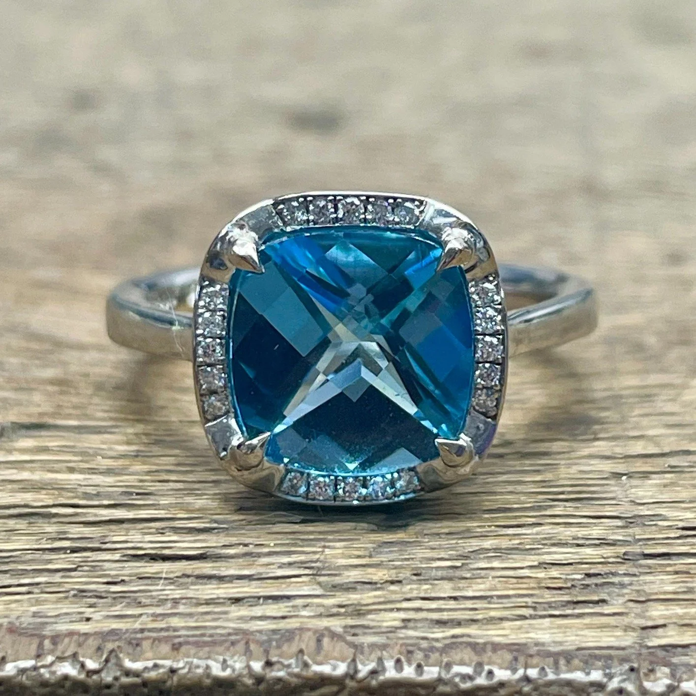 Such a wonderful London Blue Topaz stone - the checkerboard cut creates little windows of intense, luminous bright blue, but also lets you glimpse all the way through to the point of the stone - so many shapes to spot, it's rather mesmerising when it