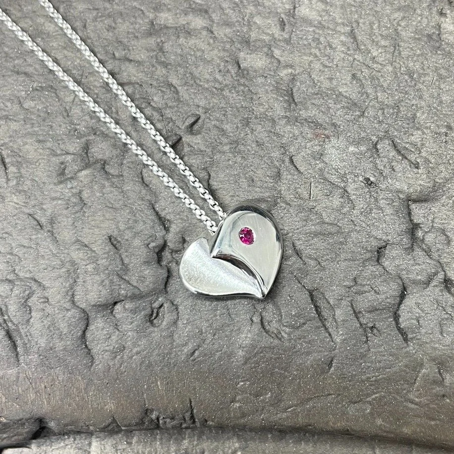 If you're looking for a cheeky little last minute valentines gift - how about this limited edition Forever Heart pendant in sterling silver, set with a delightful Ruby.  It's hard to capture the 3D nature of this lovely piece which has both a polishe