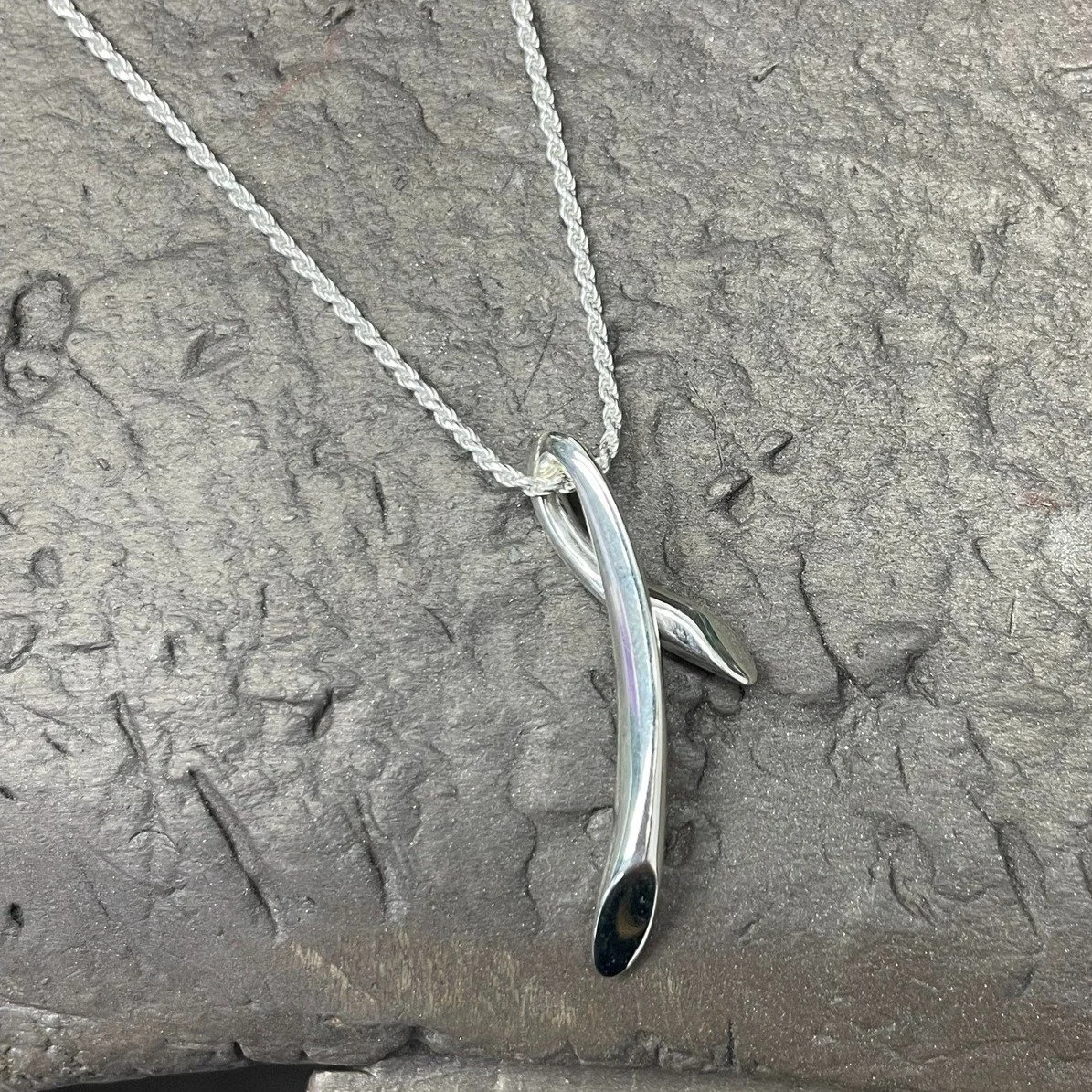 The Flute collection was one of our first ever designs here at Simon Pure, and we've been happily revisiting it over the last couple of months.  We've just added this Flute Kiss pendant in sterling silver to the shelves. Pop in or take a look online 