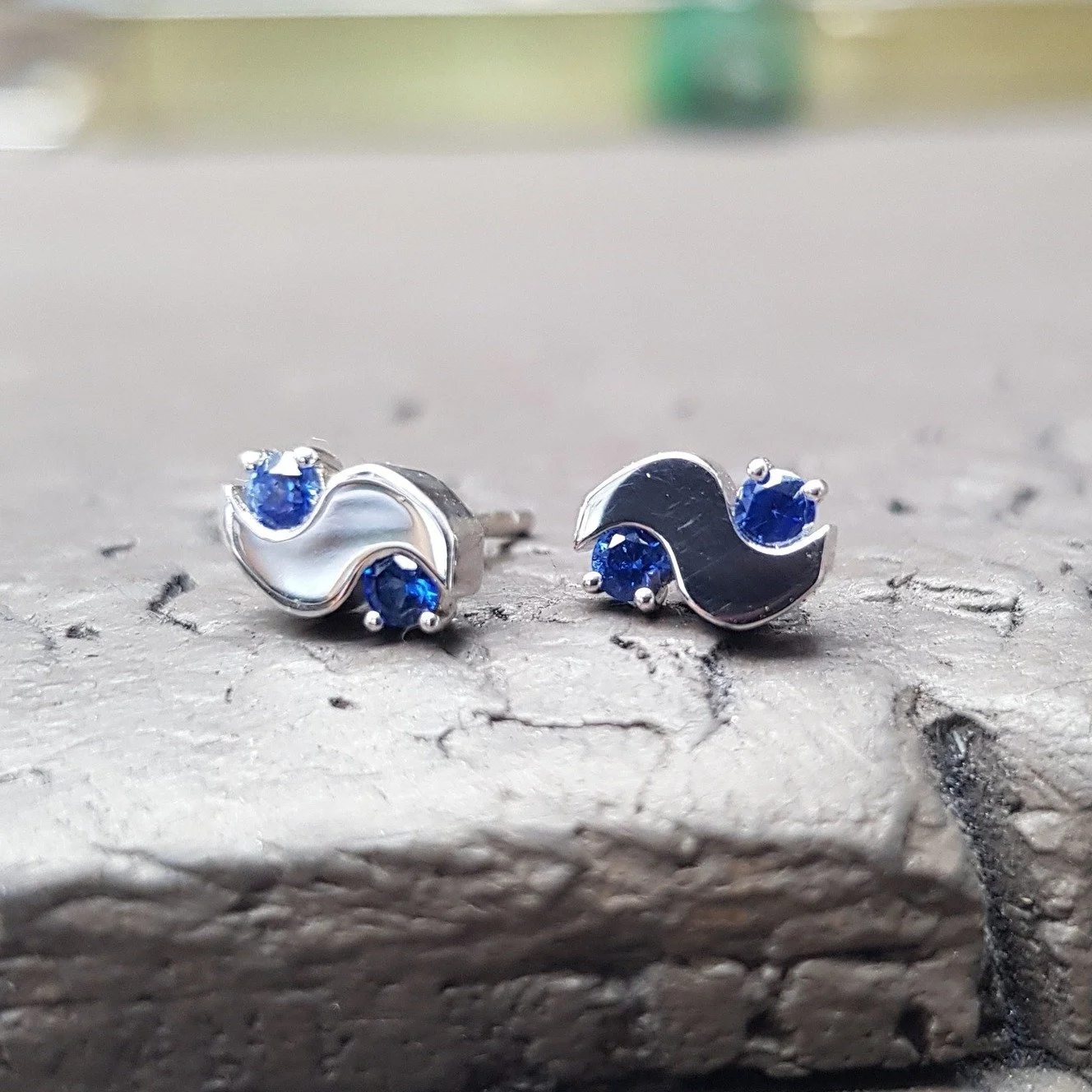 A selection of our blue sapphire studs for your perusal - in order - Mini Meander in 9ct white gold, Promise marquise sapphire in 9ct yellow gold and Twister sapphire studs in 9ct yellow gold.