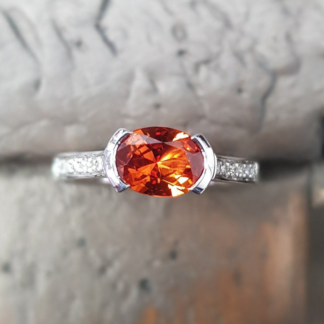 Pure Delight - just nestling it's way on to the shelf today is this unique Oval Orange Sapphire ring - set in 9ct white gold with diamonds on the shoulders - wouldn't this make a stunning engagement ring - maybe with a matching diamond set wedding ba
