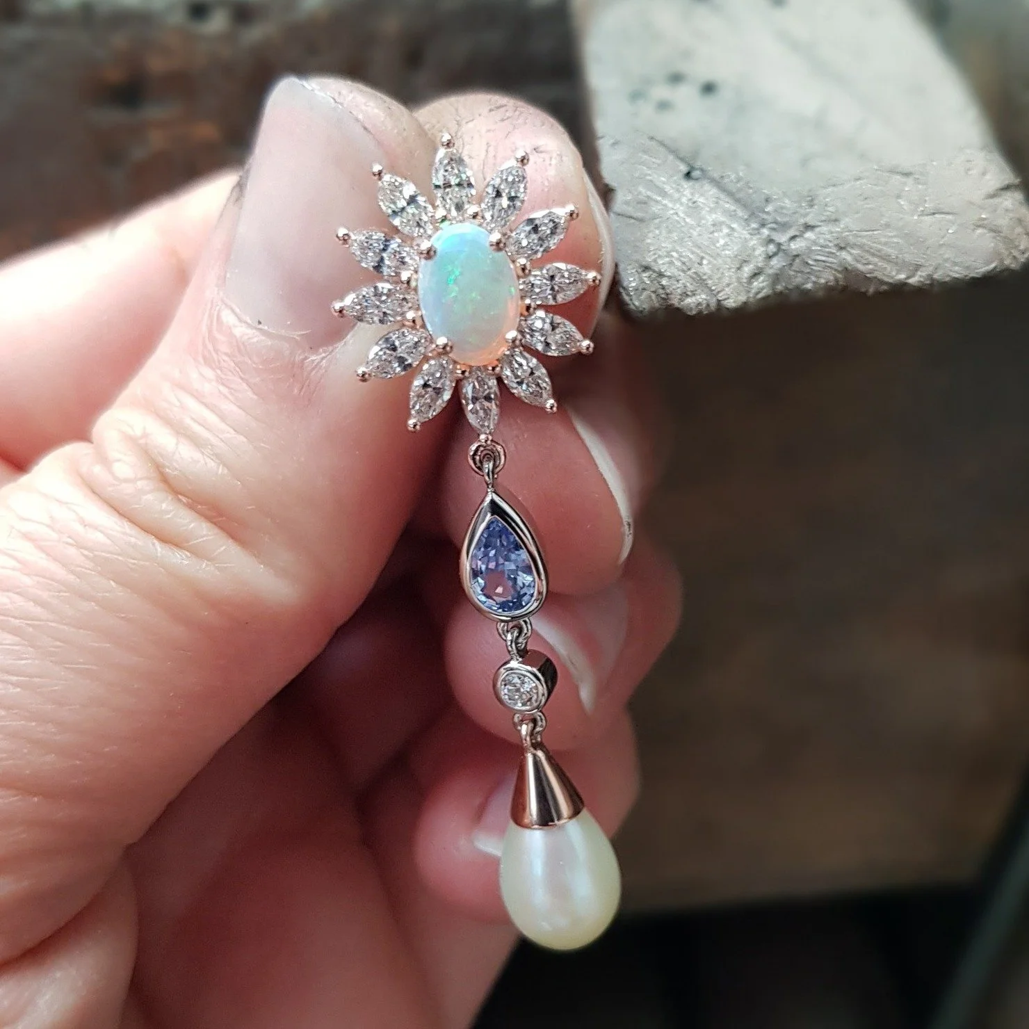 What a delight to work on these bespoke earrings for a very special birthday for our wonderful customer. Central opals with a halo of marquise diamonds, holding a chandelier of pale blue sapphire, diamond and drop pearl. 

Matching all the colourways