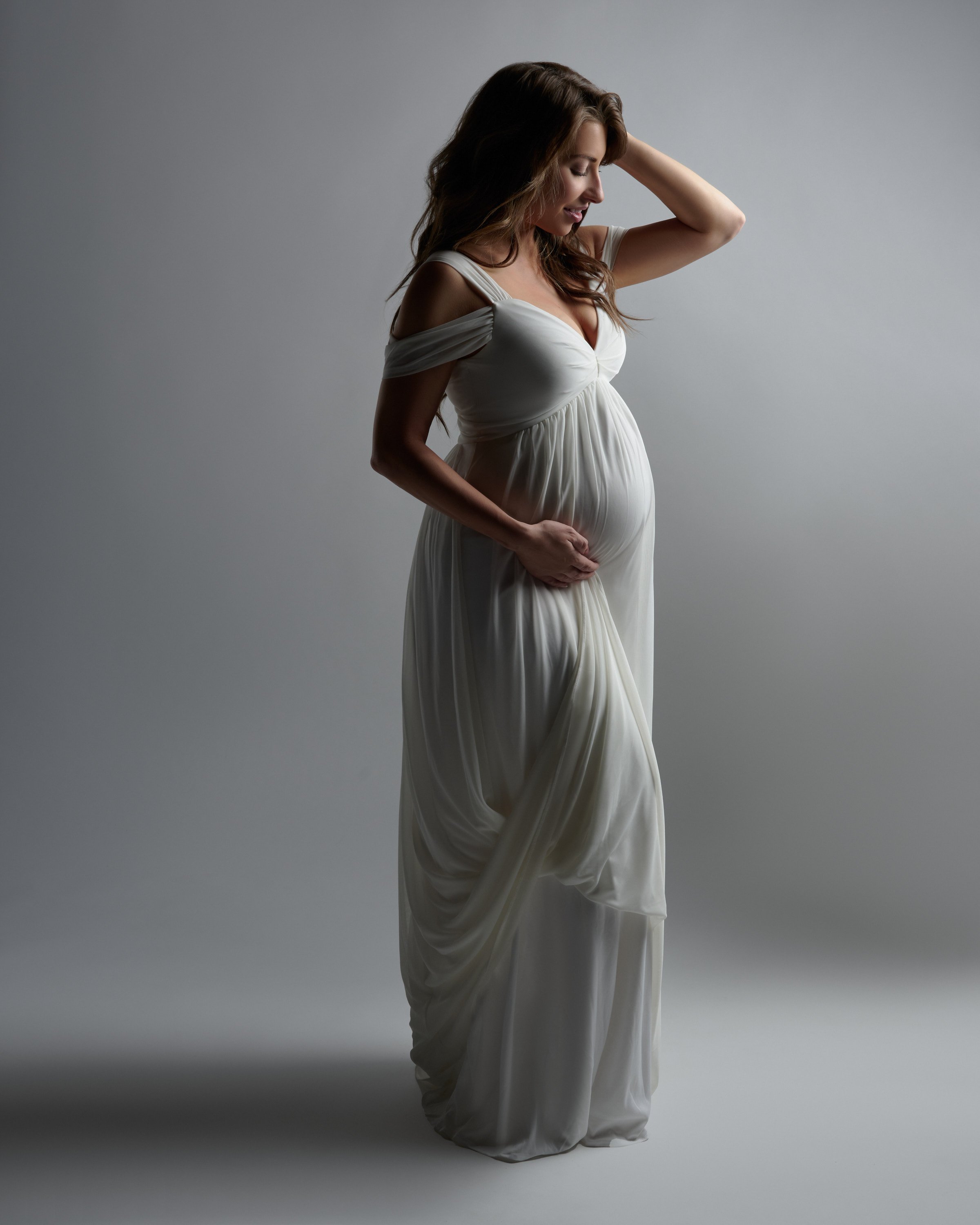 Boutique-worthy gown worn in the Denver studio, proof that shopping smart pays off.