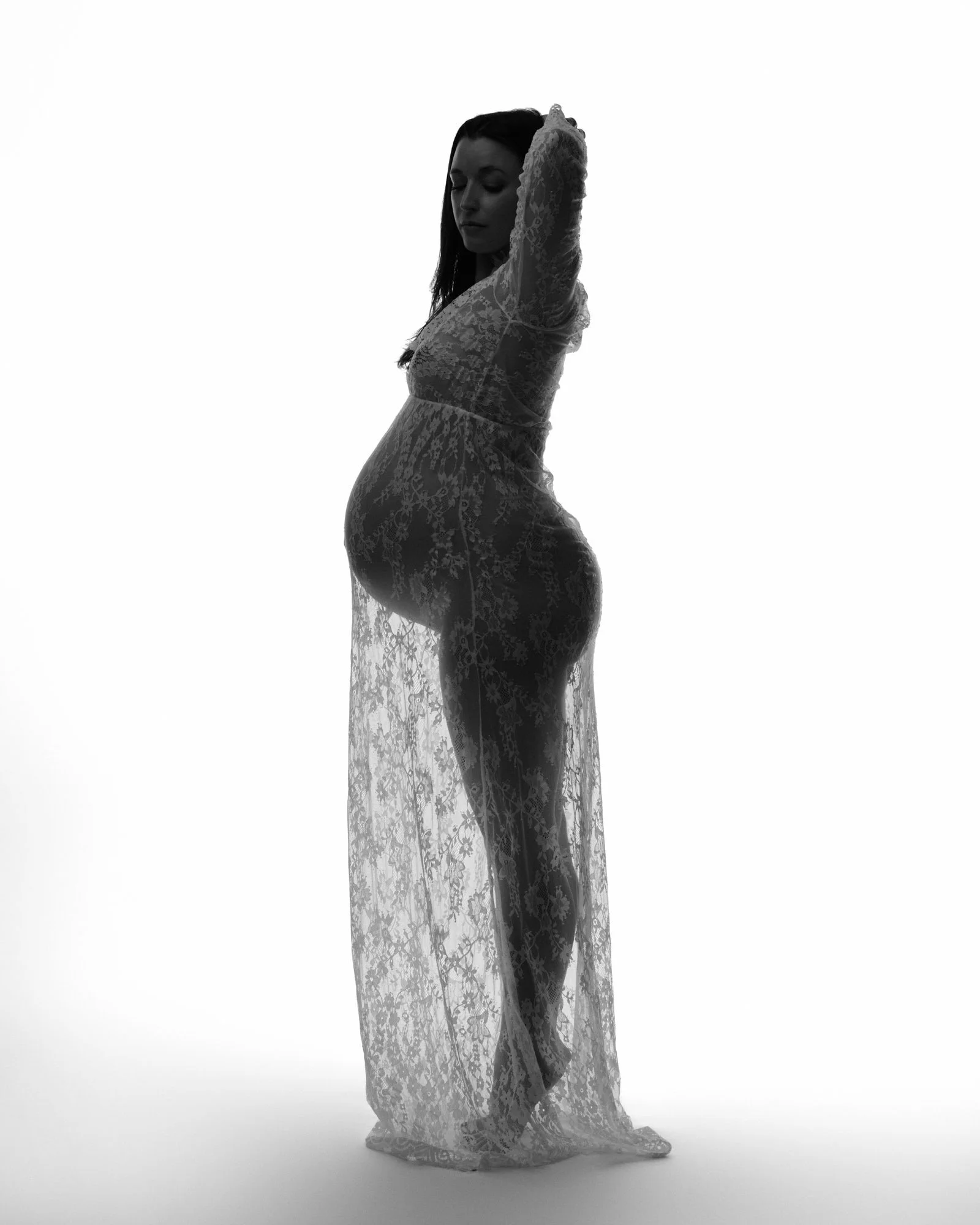 Structured boutique gown holding its shape under studio light.