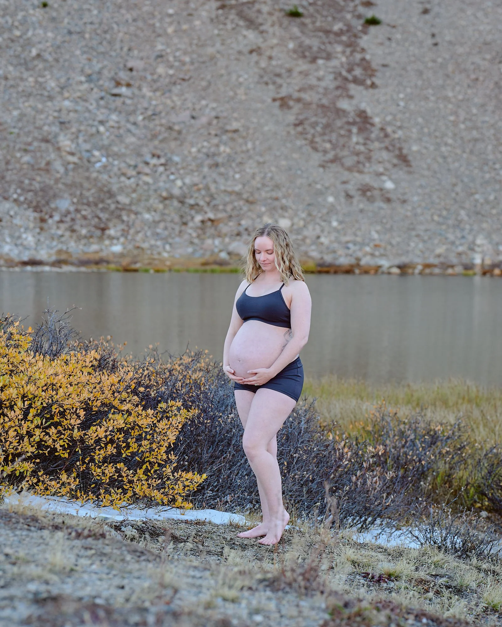 Michele at an alpine lake during her maternity session in the Colorado high country.