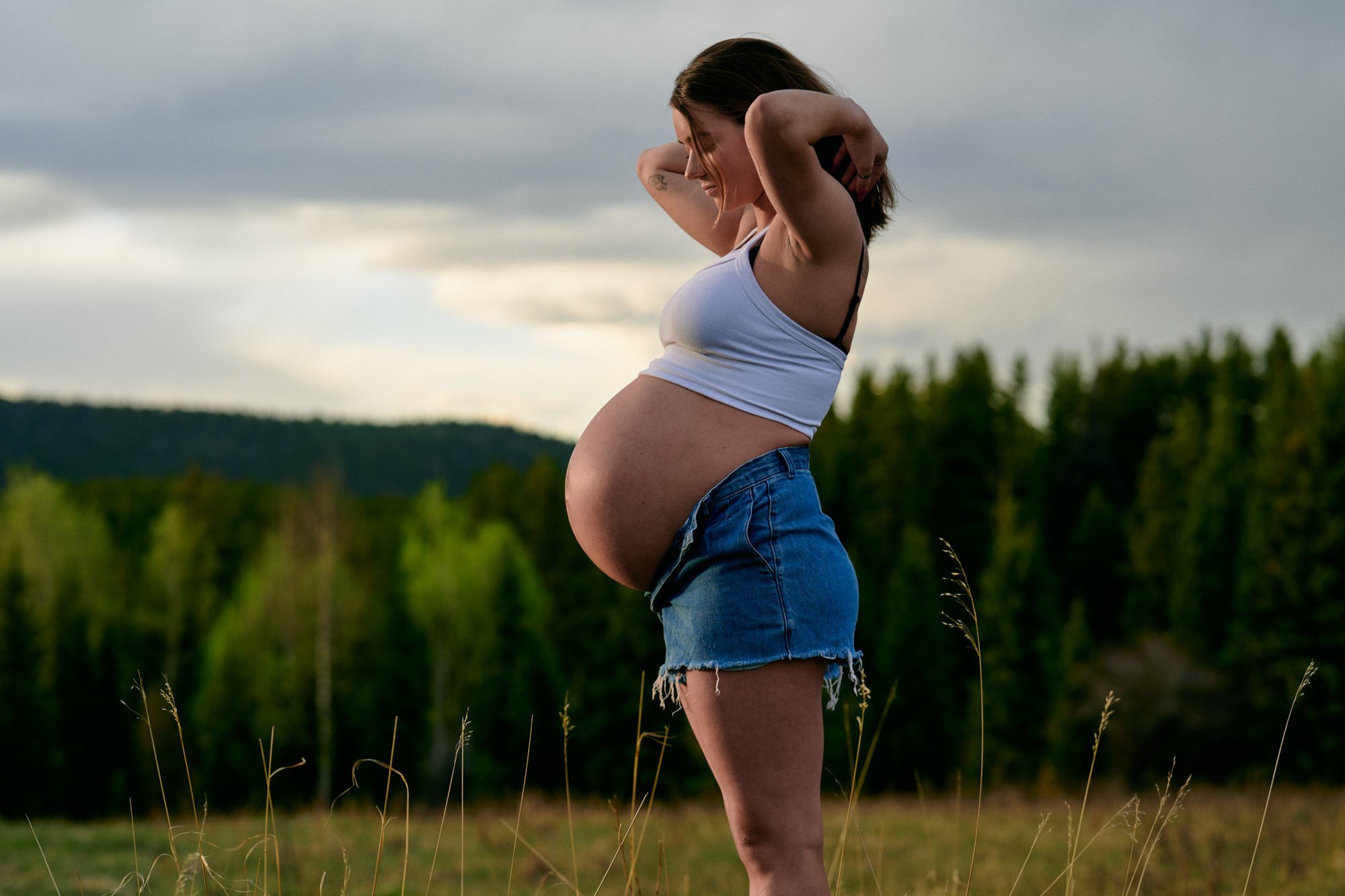 Studio portrait planned around the best time for maternity photos, before the due date crunch.