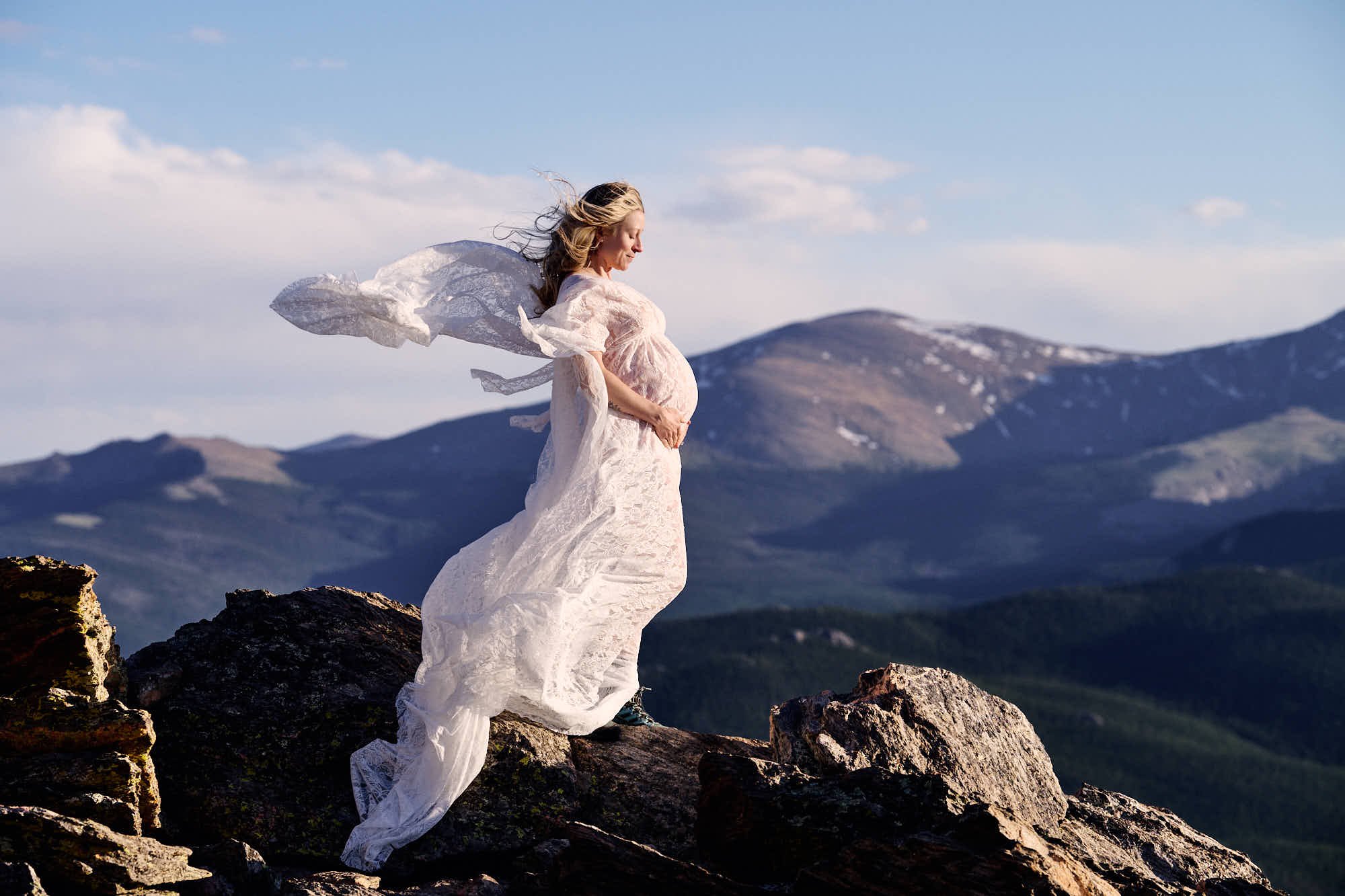 Blush lace and a streaming shawl over teal hiking shoes, the WanderBump session in the high country.