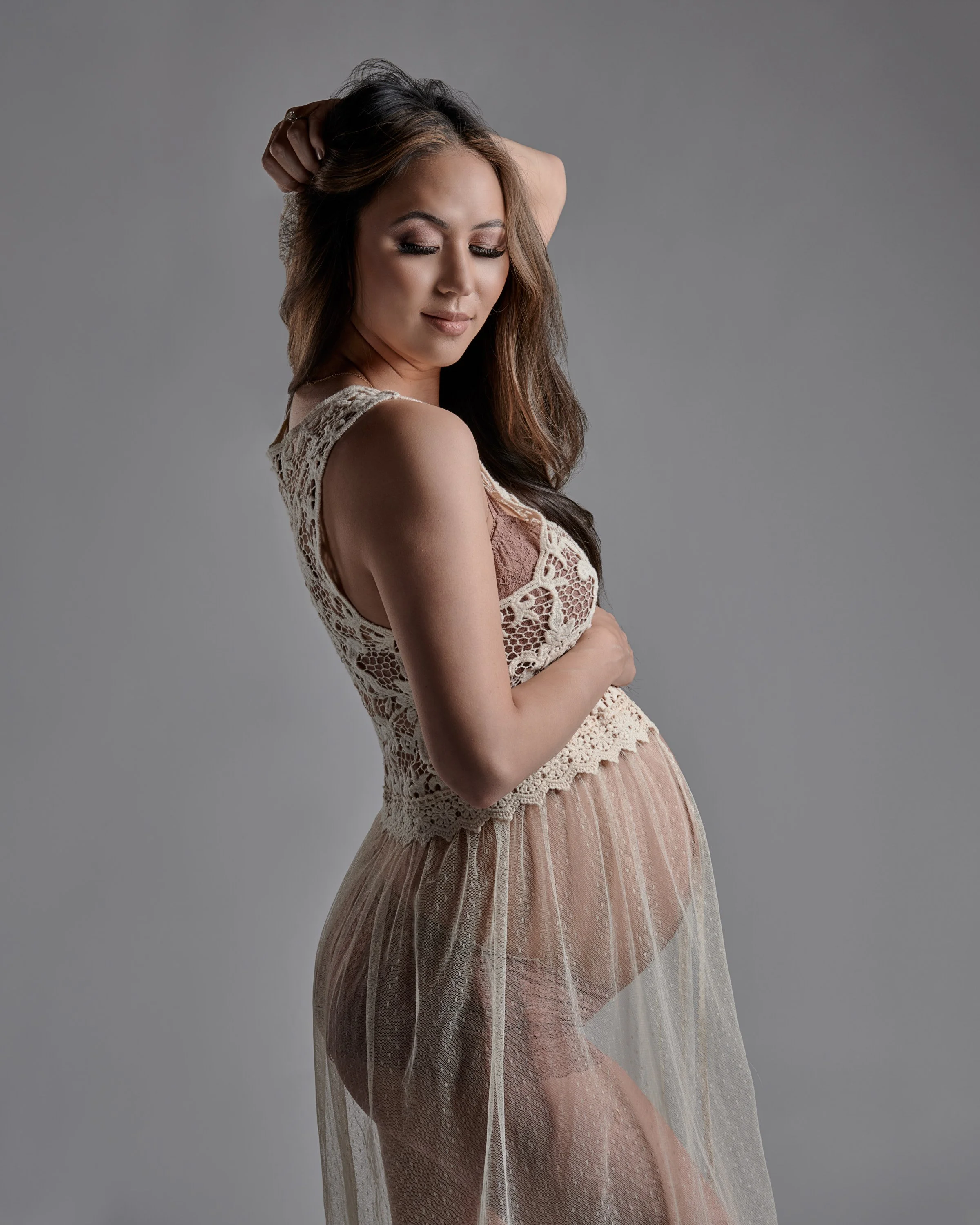 Champagne lace gown and a soft updo, gentle light in the Denver studio.
