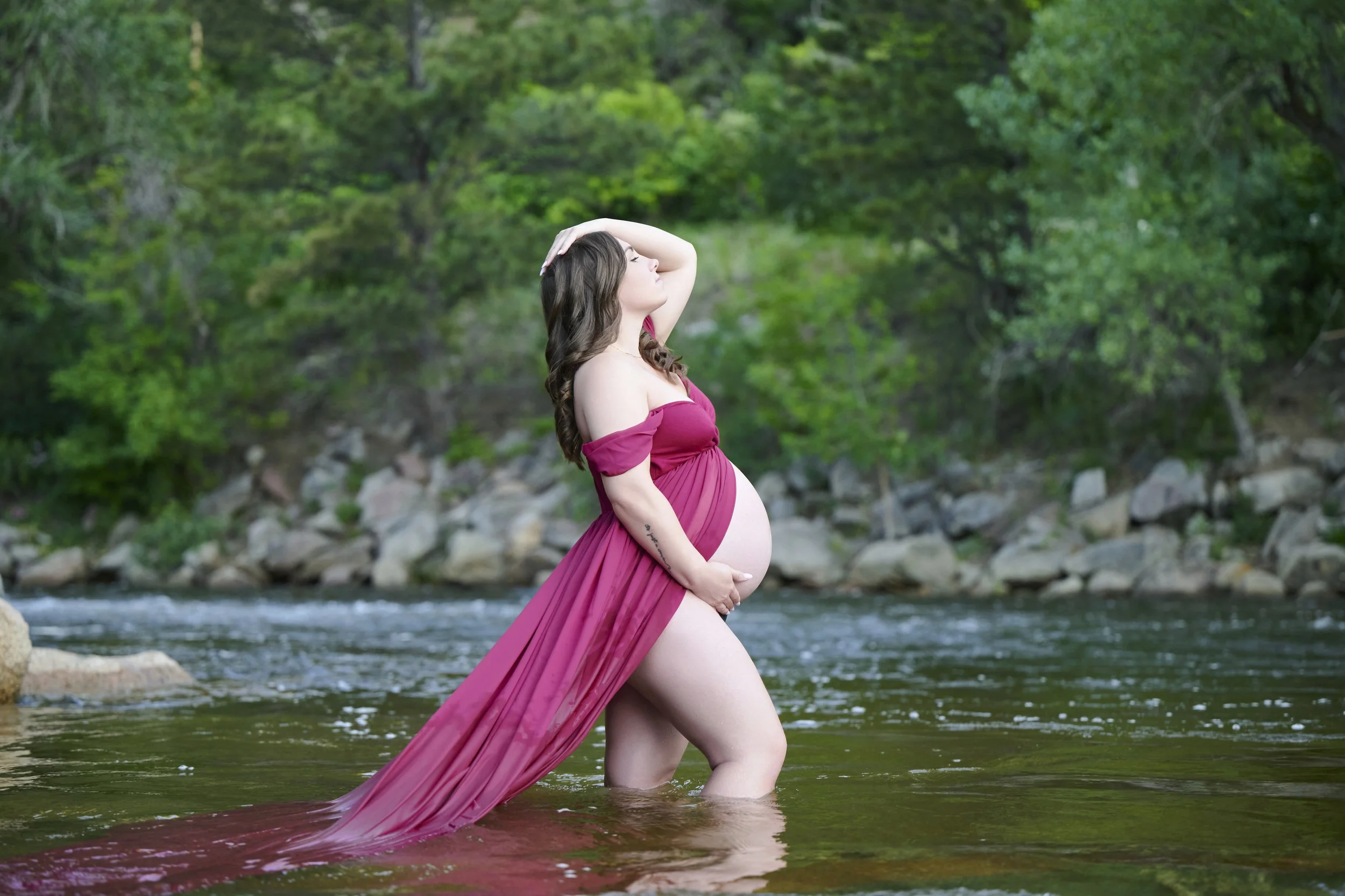 Brooke during her creekside maternity session in Colorado.