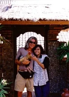 Randy and a friend framed in a carved Balinese stone entrance, a small candid travel snapshot.