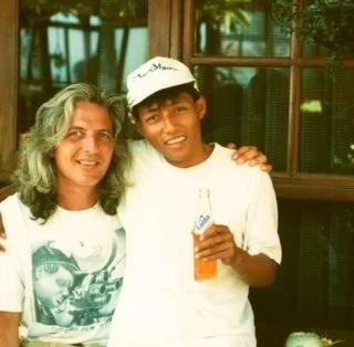 Randy in 1993 with Nyoman, the young Balinese man who introduced him to local food and traditions, both smiling outdoors in Lovina.