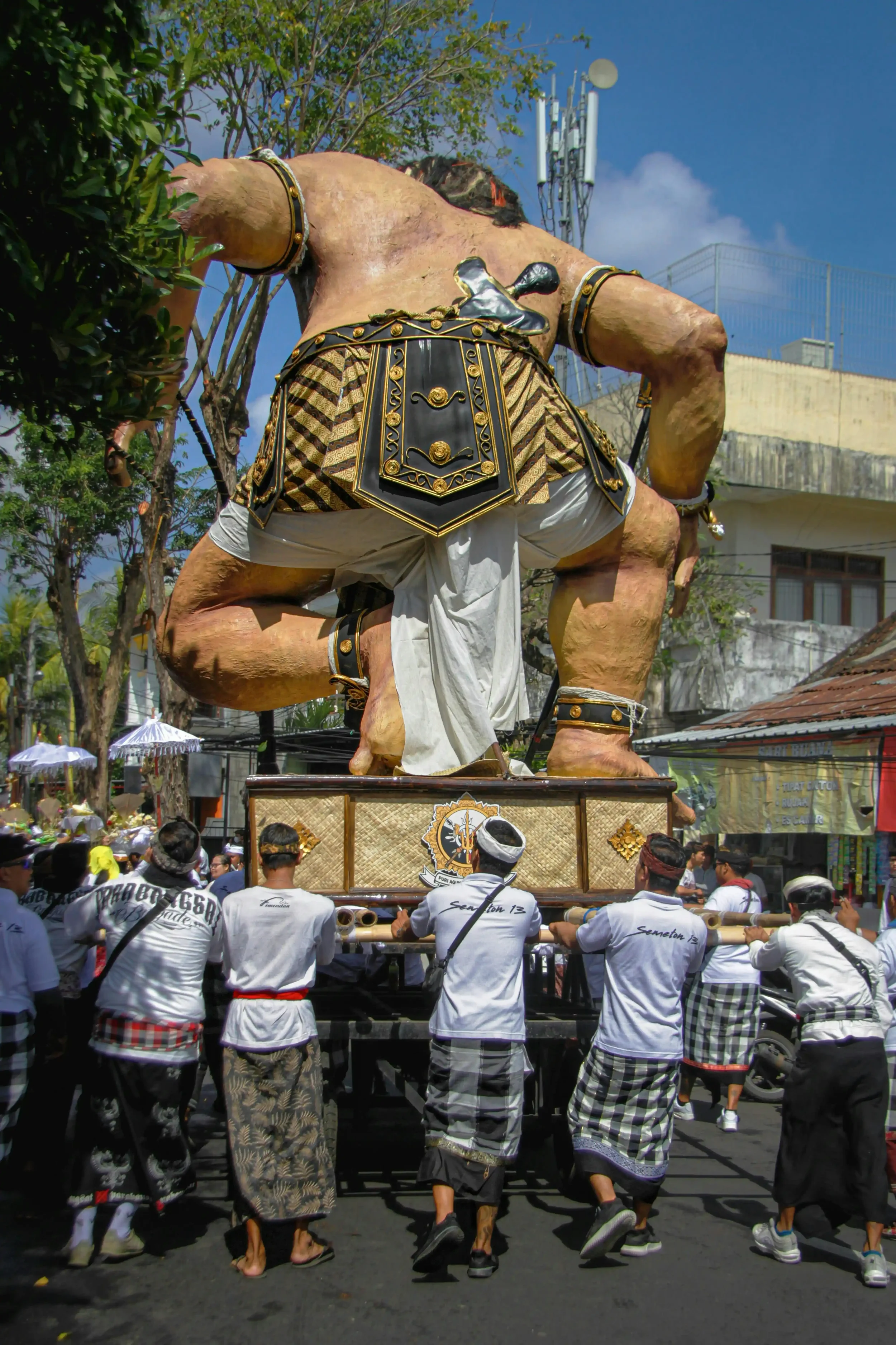 An ogoh-ogoh demon statue carried through the street by villagers before Nyepi in Bali