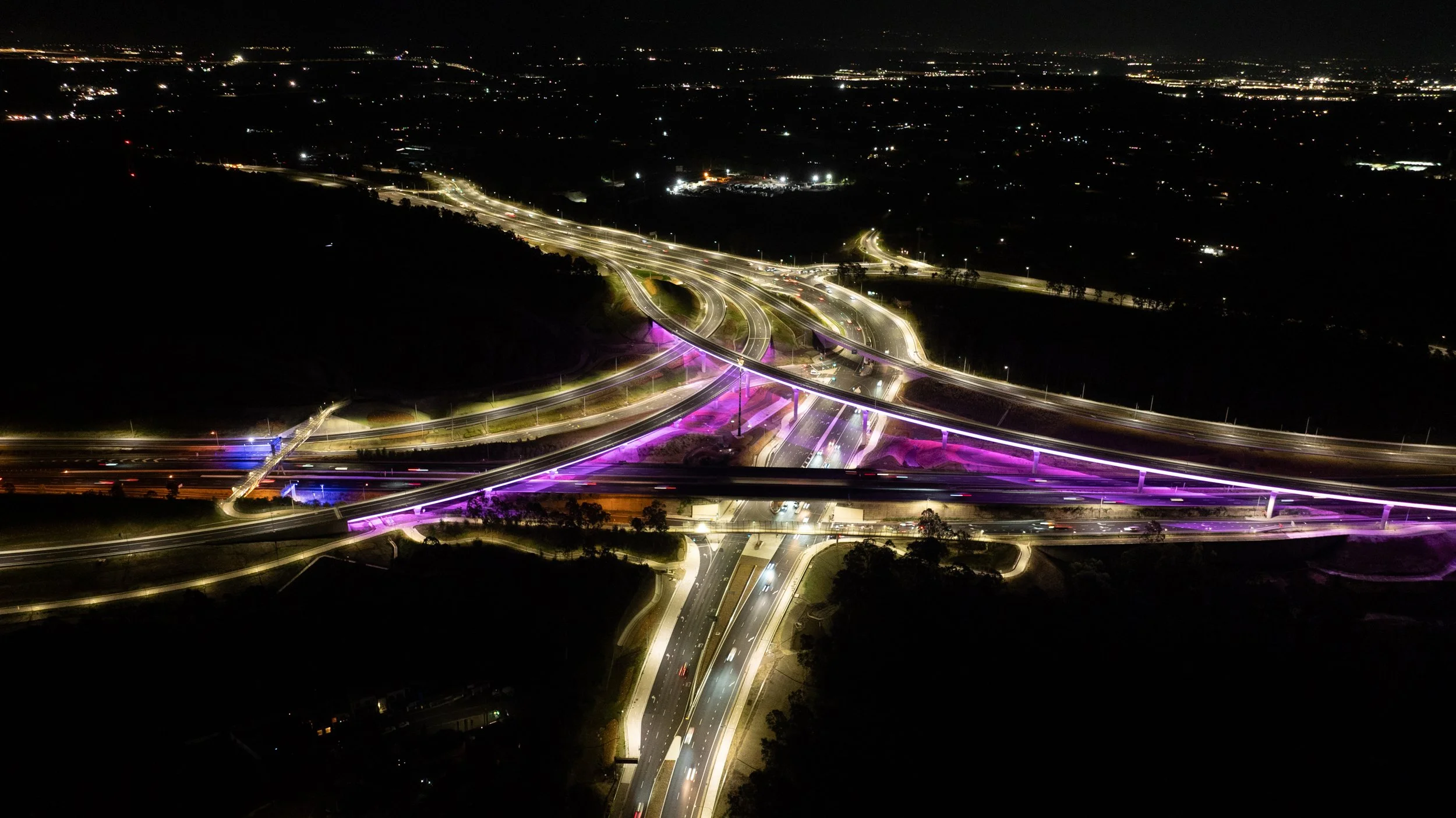 M7_66 M7M12 Interchange at night aerial view looking west designed by SCP - Ruth Gold photography