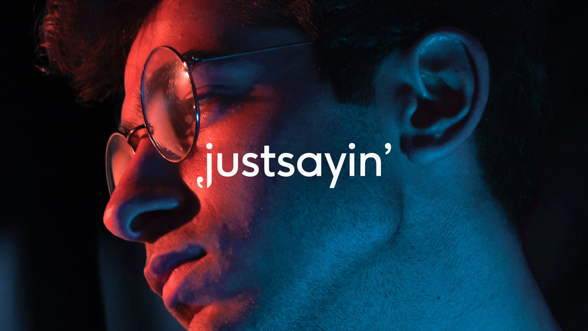Duotone image of a contemplative young man with the word 'justsayin' overlaid.