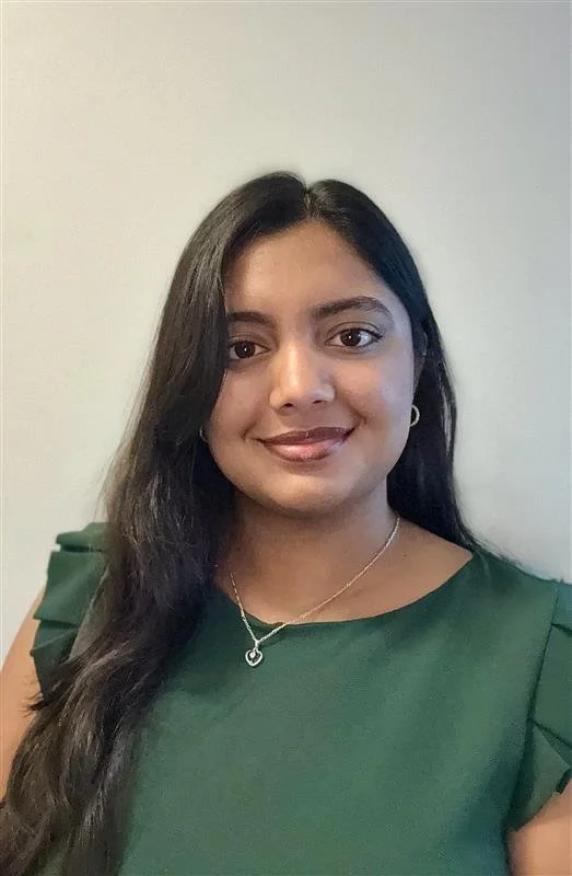 headshot of a smiling man