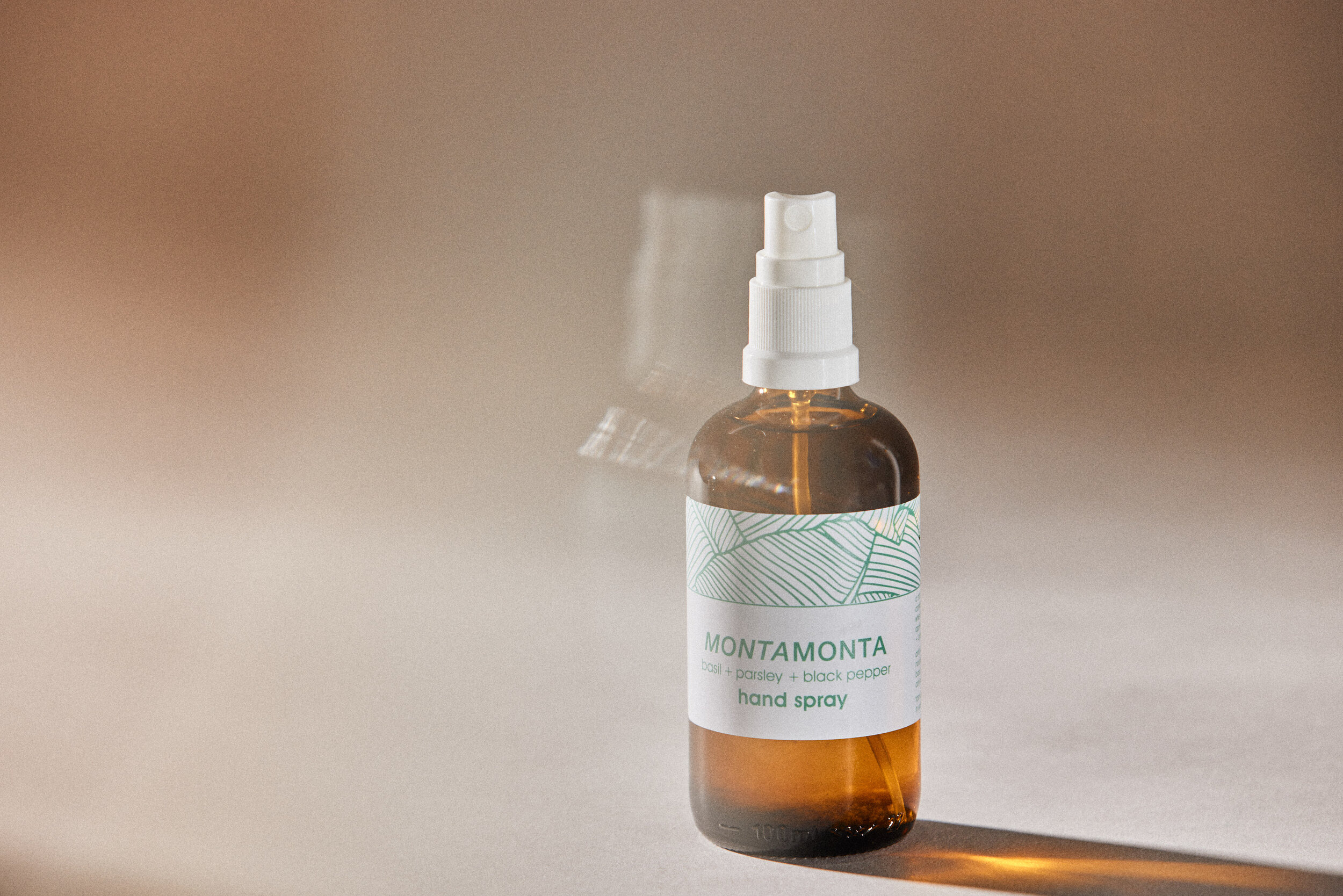 glass bottle of hand spray botanical herbal