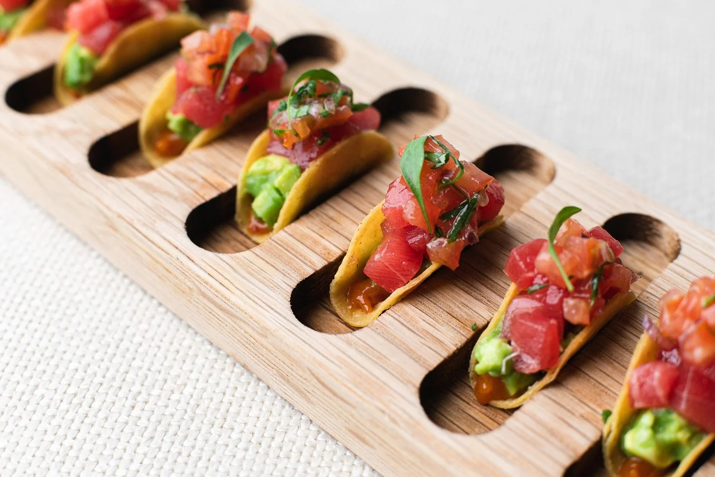 The reception is more than a welcome, it sets the tone to the evening unfolding. The first bite is so important and our refined canapés are a perfect morsel of flavour and elegance. 
Tuna tartare taco, miso, avocado & tomato salsa