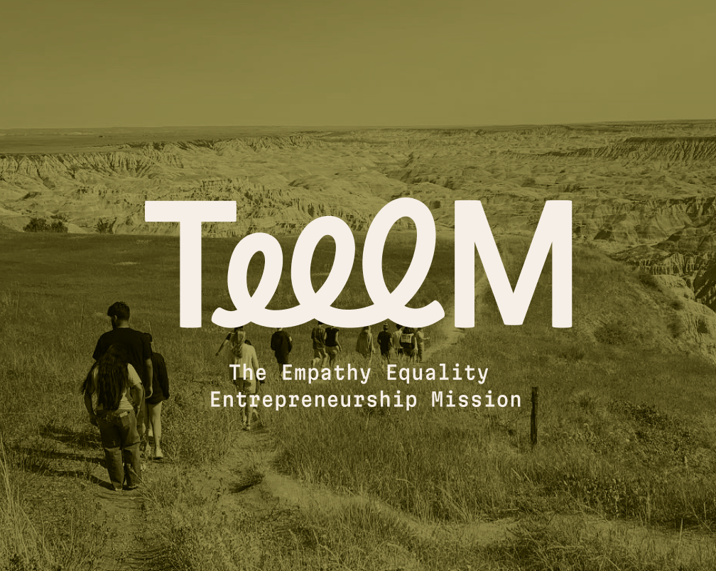Group of people walking on a trail through a grassy landscape with hills or cliffs in the background, overlaid with text reading "TEEEM" and "The Empathy Equality Entrepreneurship Mission".