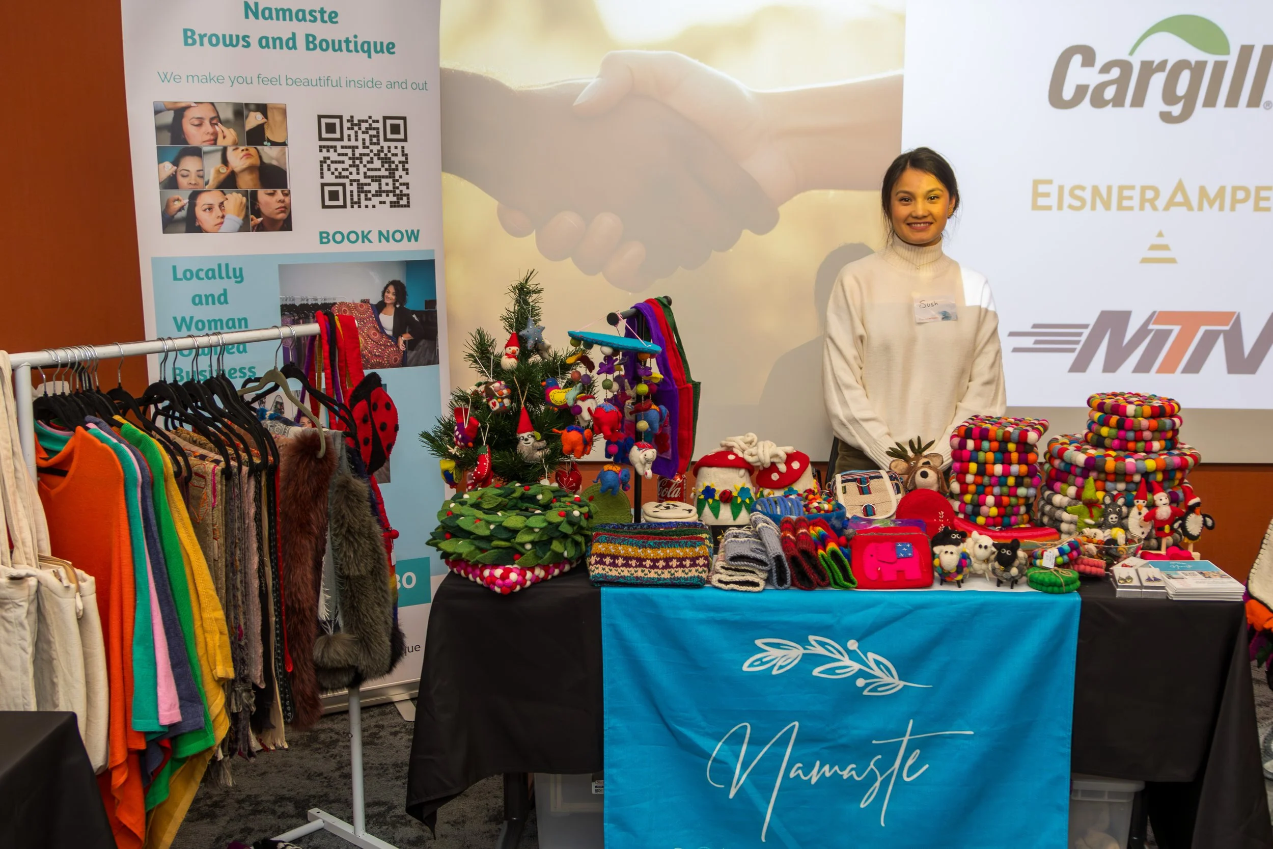 Asian woman selling goods at a holiday market