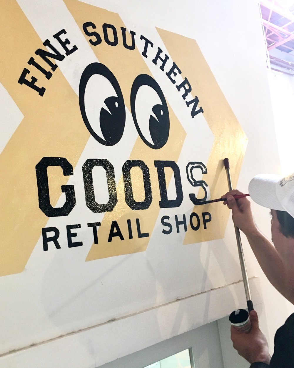 hand painted sign for fine southern goods retail shop