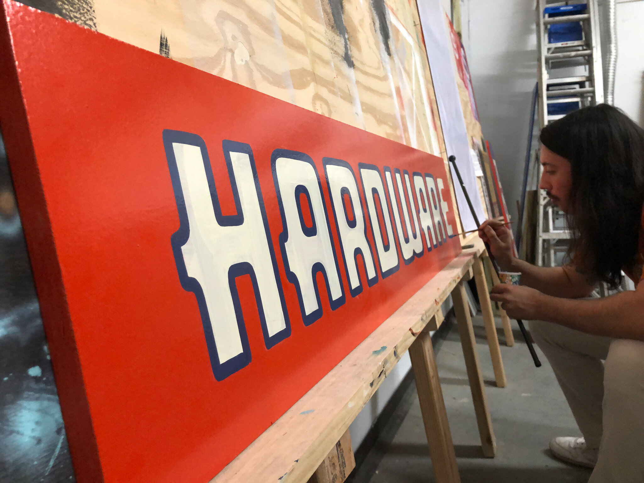 hand painted "hardware" sign