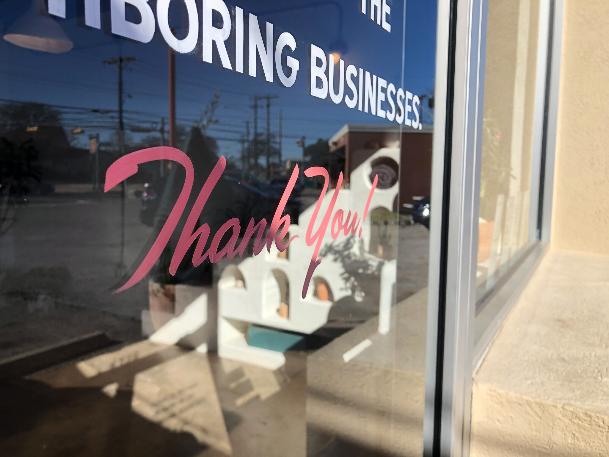 handpainted retail sign on glass