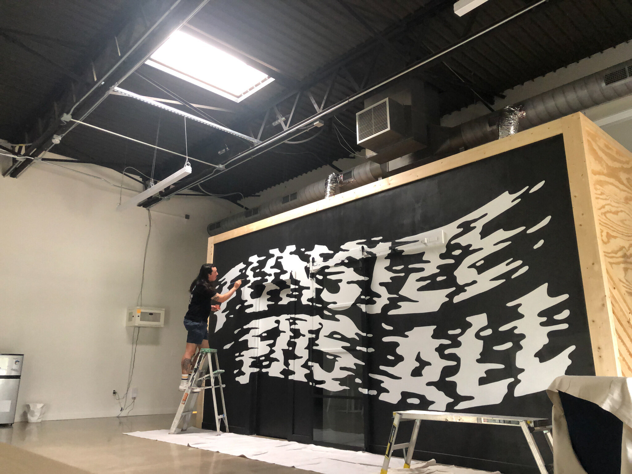 black and white interior mural by mural artist - austin texas - andrew manning