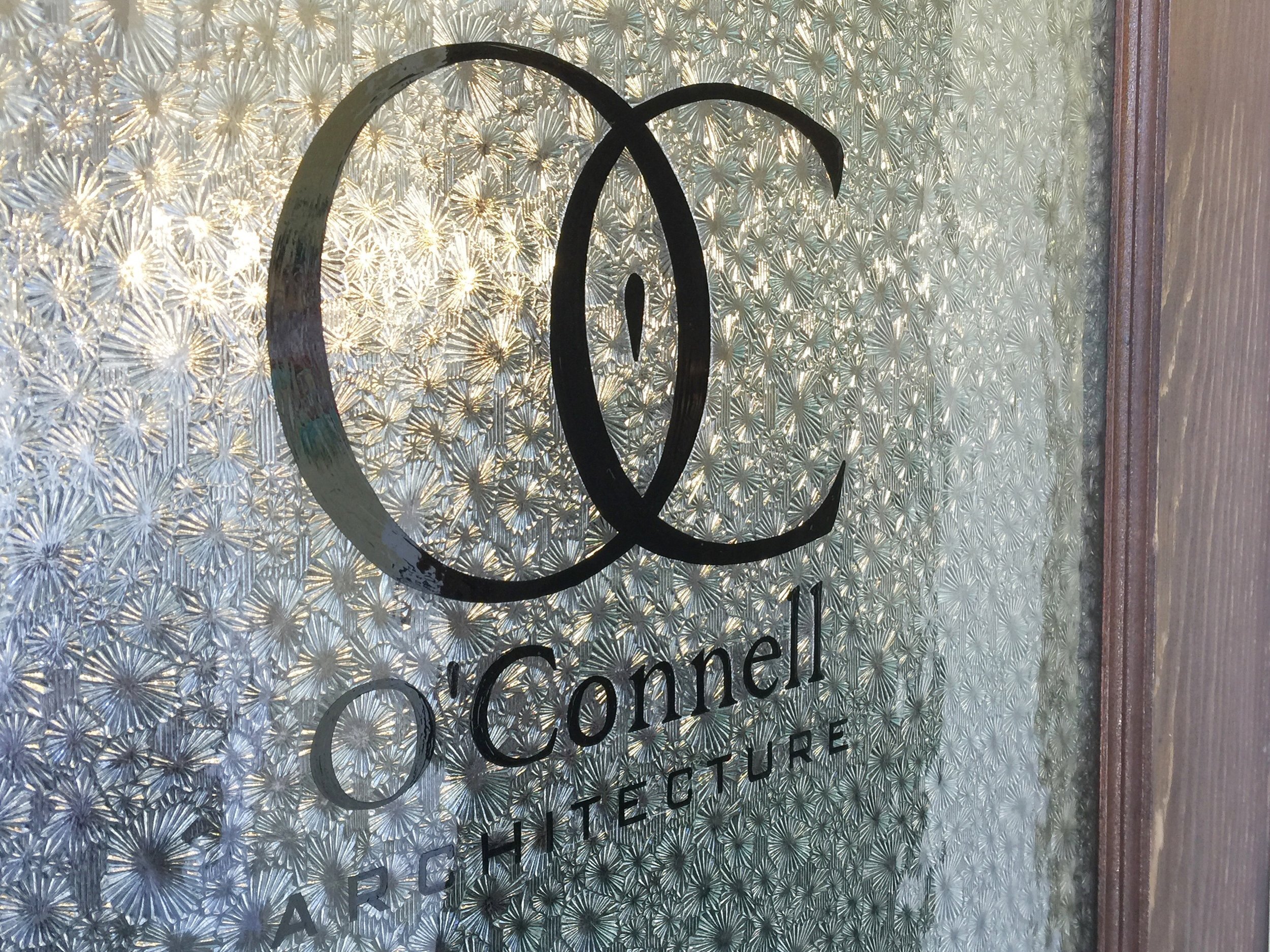 Hand Painted Logo on Glass Door - O'Connell architecture by Manning Signs 