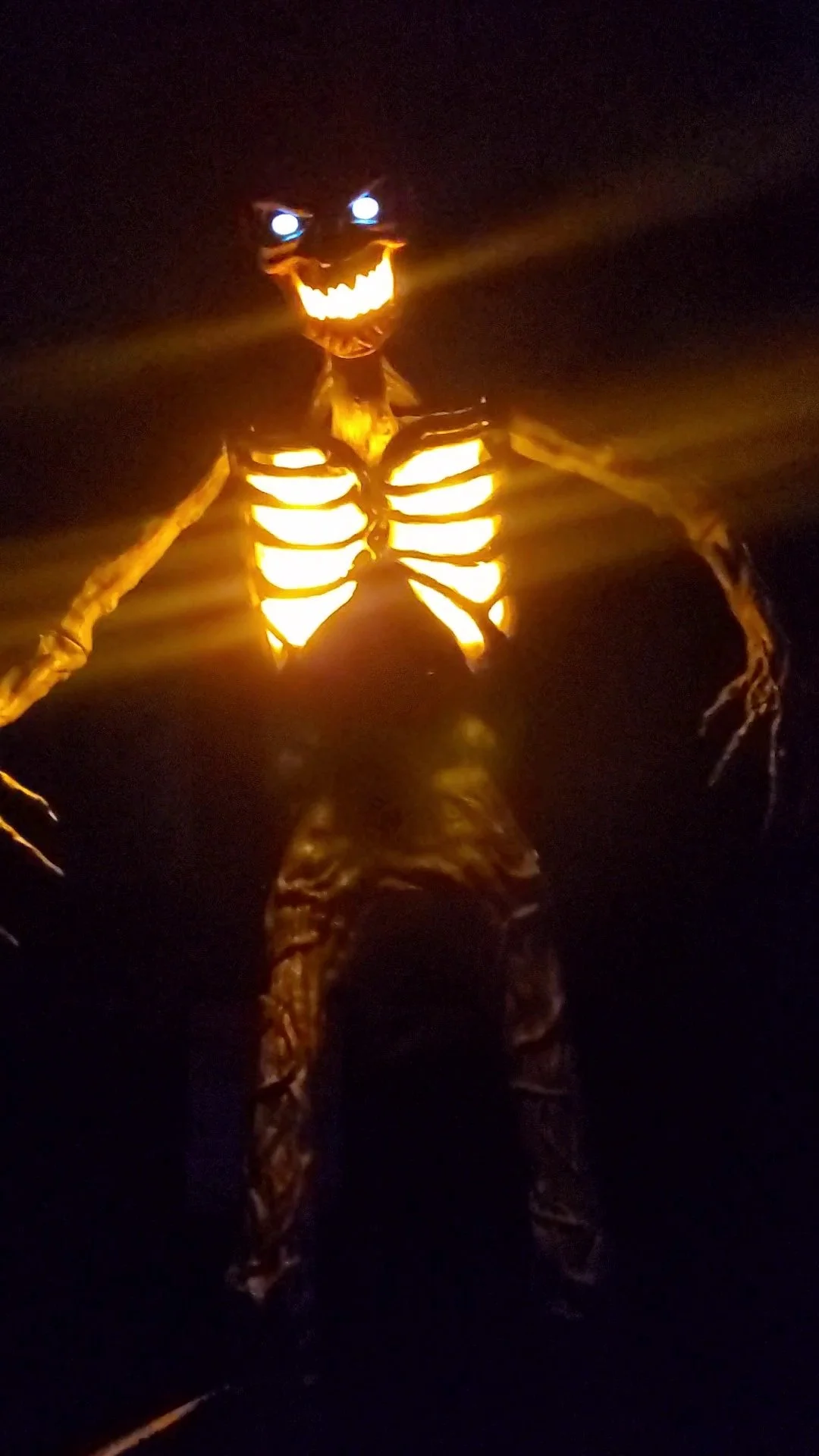 Glowing skeleton and ghost at a past Scare Park event