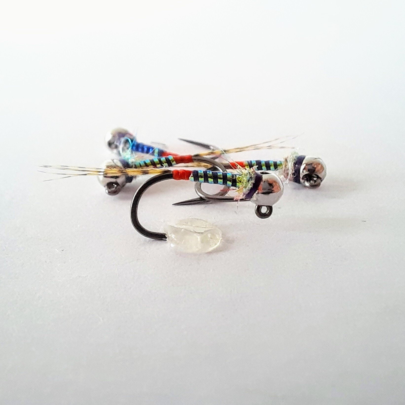 4 - Rumble Jig - Euro Nymph. Trout Flies. Fly Fishing Flies. Colorado Fishing. Barbless. Tungsten. UV. Epoxy. Attractor. Bead Head Nymph.