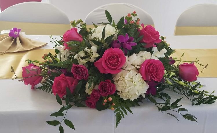 sweetheart table centerpiece with Pink Floyd roses, purple dendrobium orchid, hypericum.jpeg
