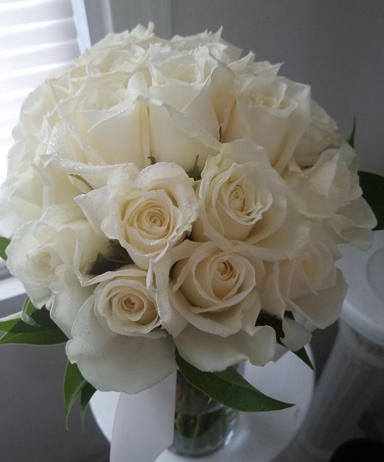 bridal bouquet hand tied of Eskimo roses.jpeg