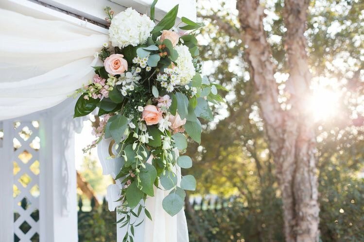Ceremony Arbor Spray Shimmer Roses, Orchids, Peach stock, Eucalyptus and Ruscus.jpeg