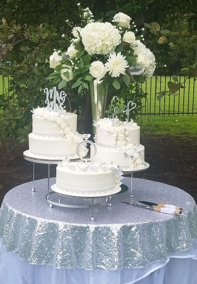 Tall centerpiece Cake Table with Silver Sequin Topper.jpeg