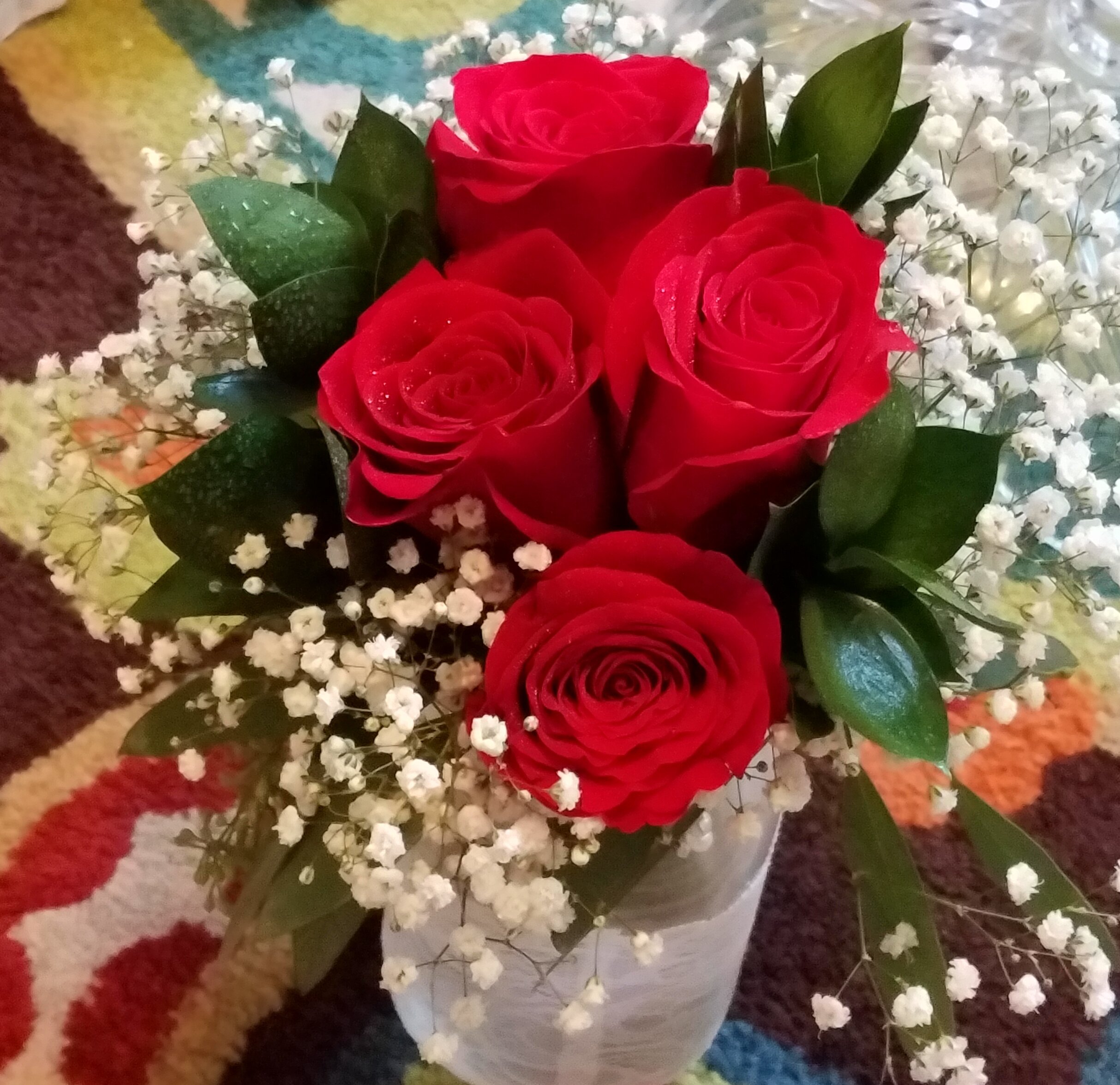 Mason jar centerpiece  Red Freedom Roses, baby’s breath and ruscus .JPG