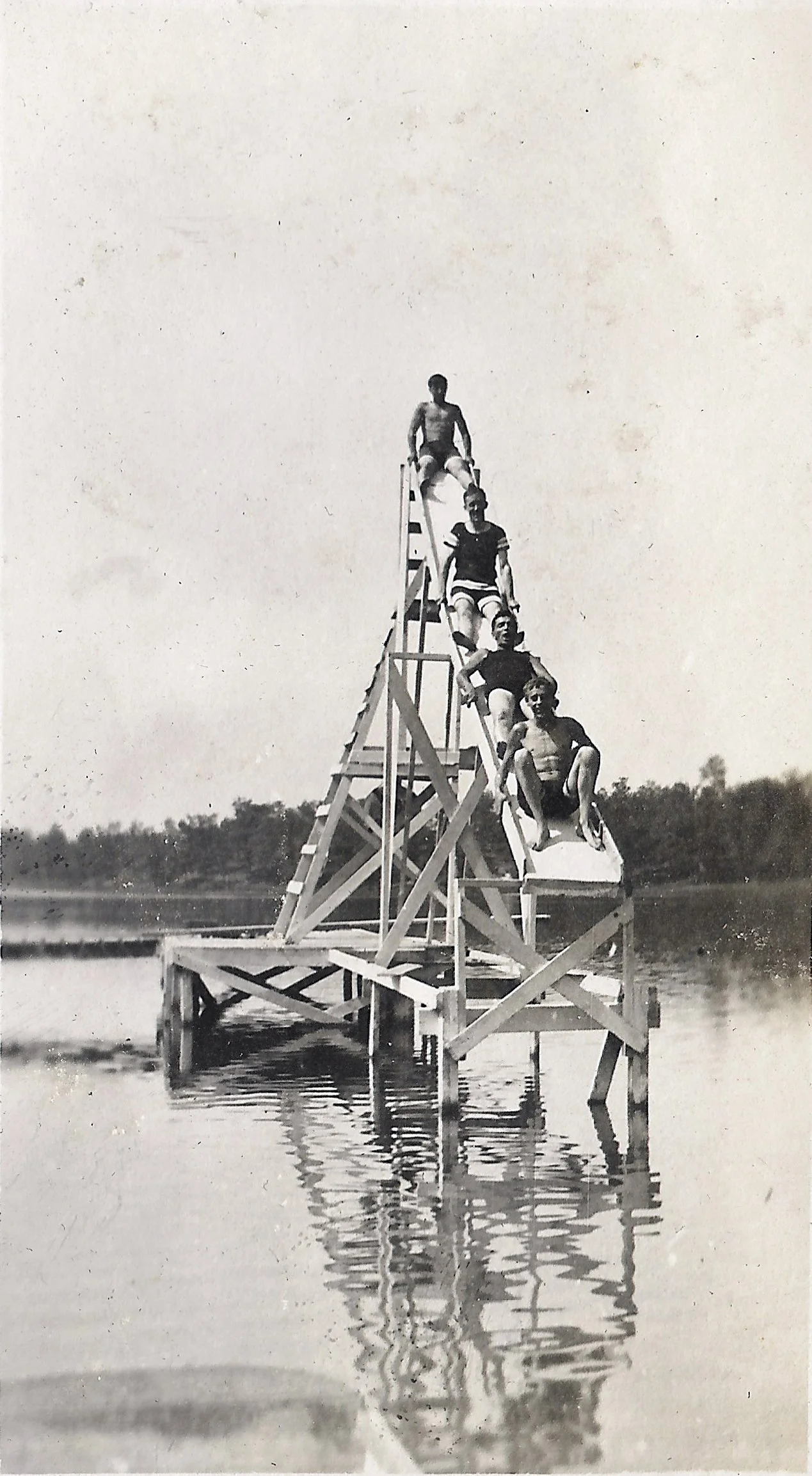 1920s - Campers on the water slide in the swimming area