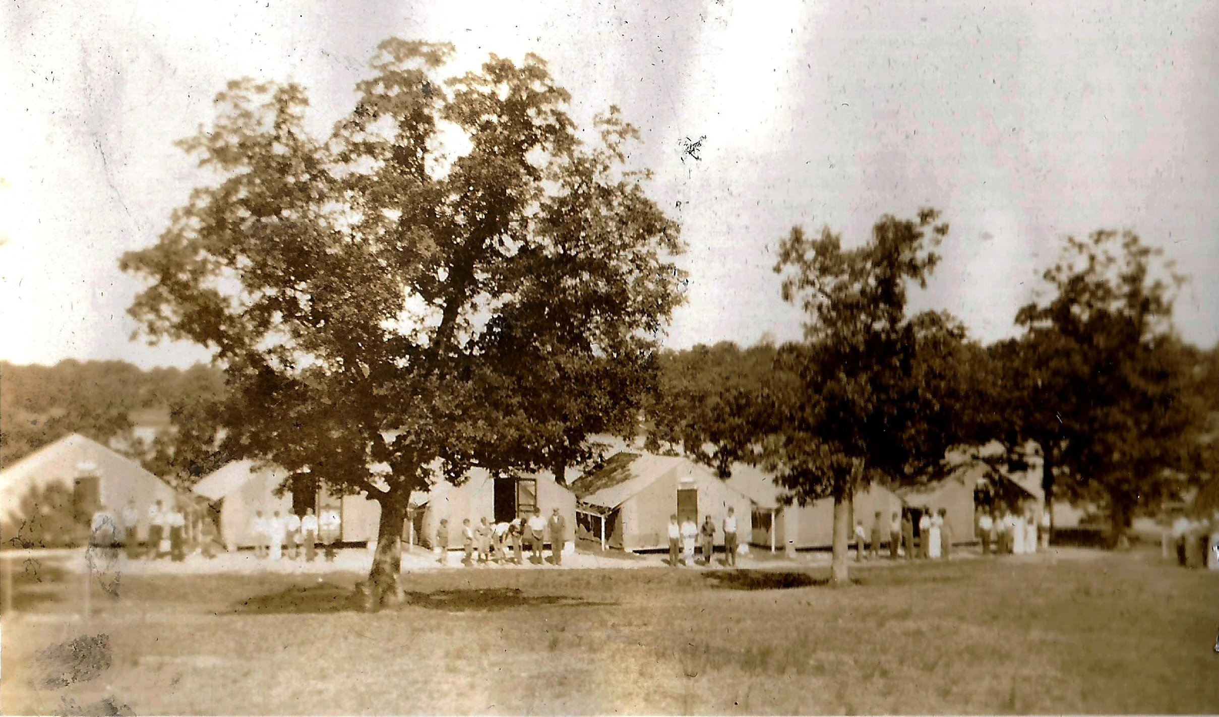 1920s - Campers outside of their tents