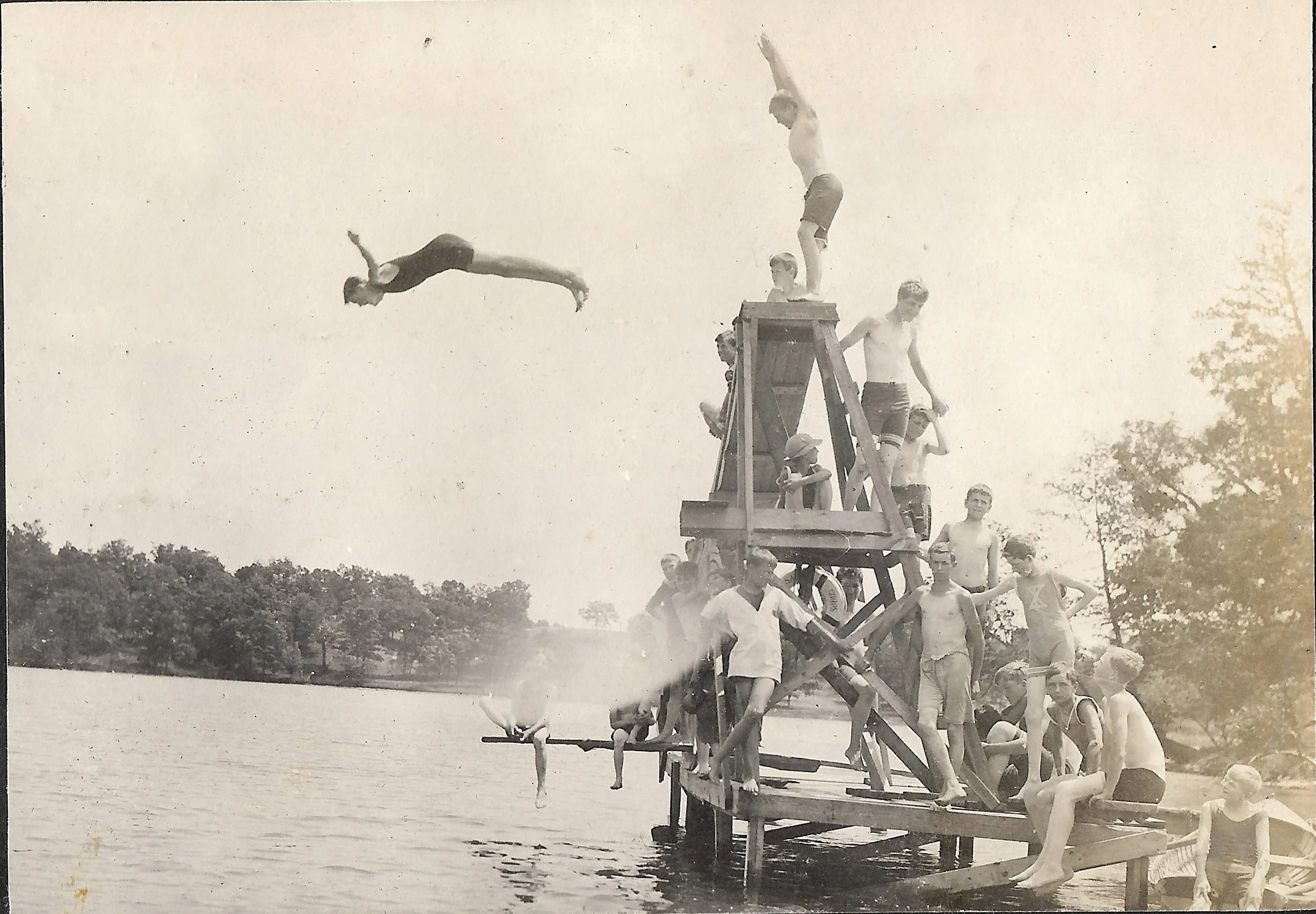 1900s - Camper diving off of the diving platform at the swimming area