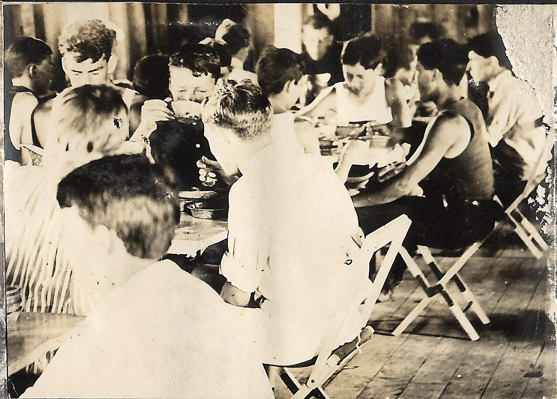 1910s - Campers enjoying a meal inside the first Dining Hall Building