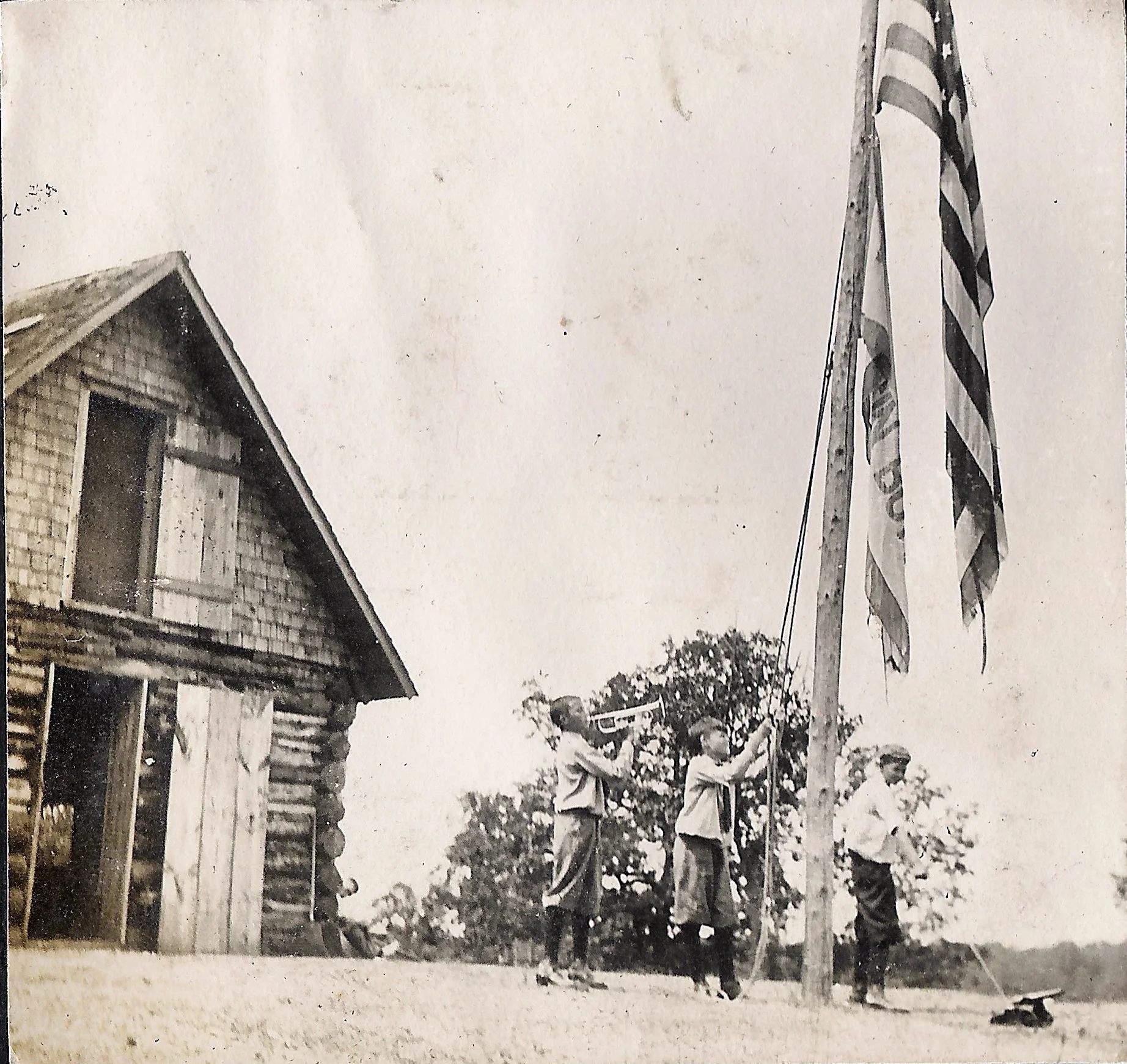 1910s - Flag raising outside of the Headquarters Building