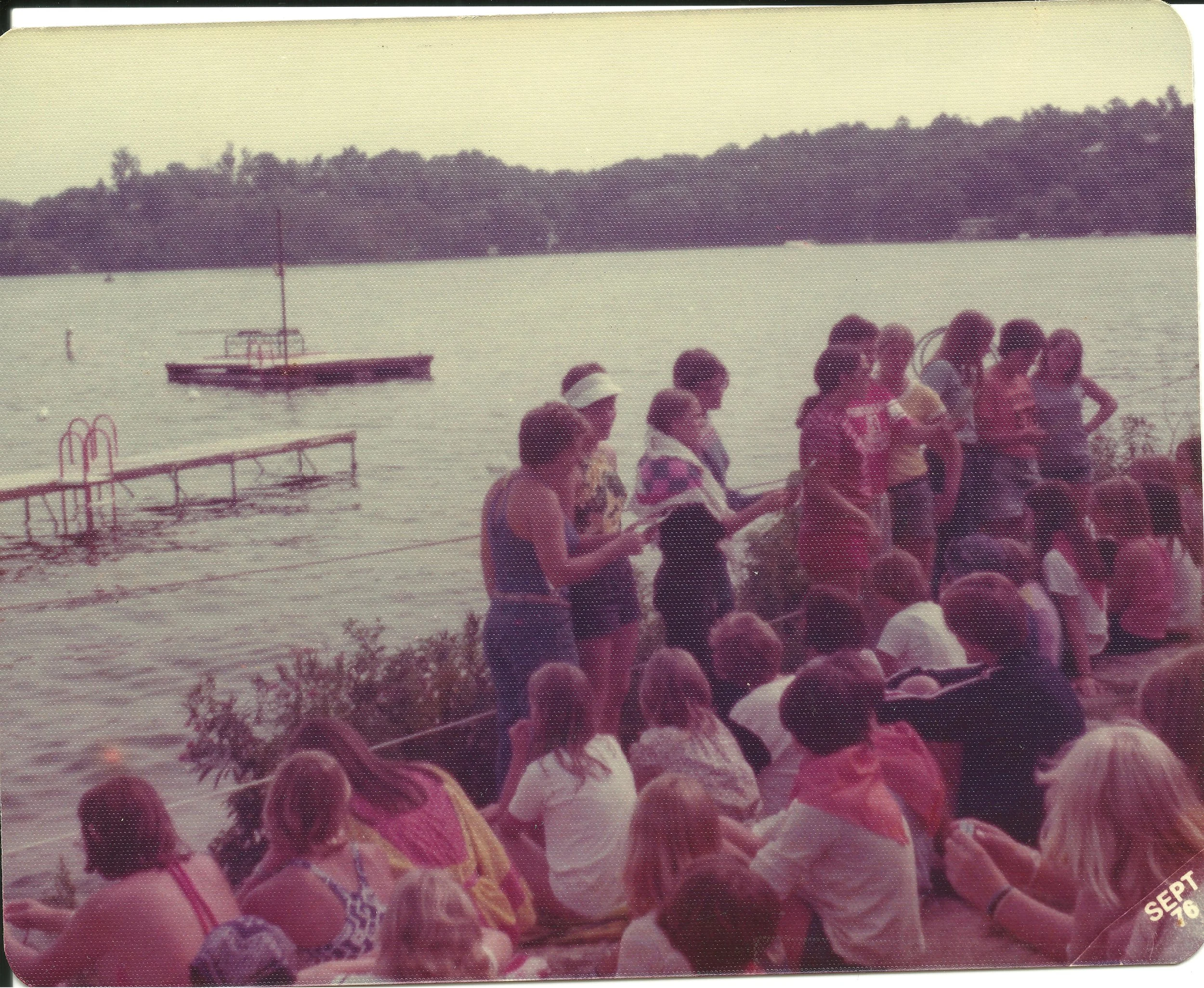 1976 - Girls Camp Program Announcements at the Swimming Area