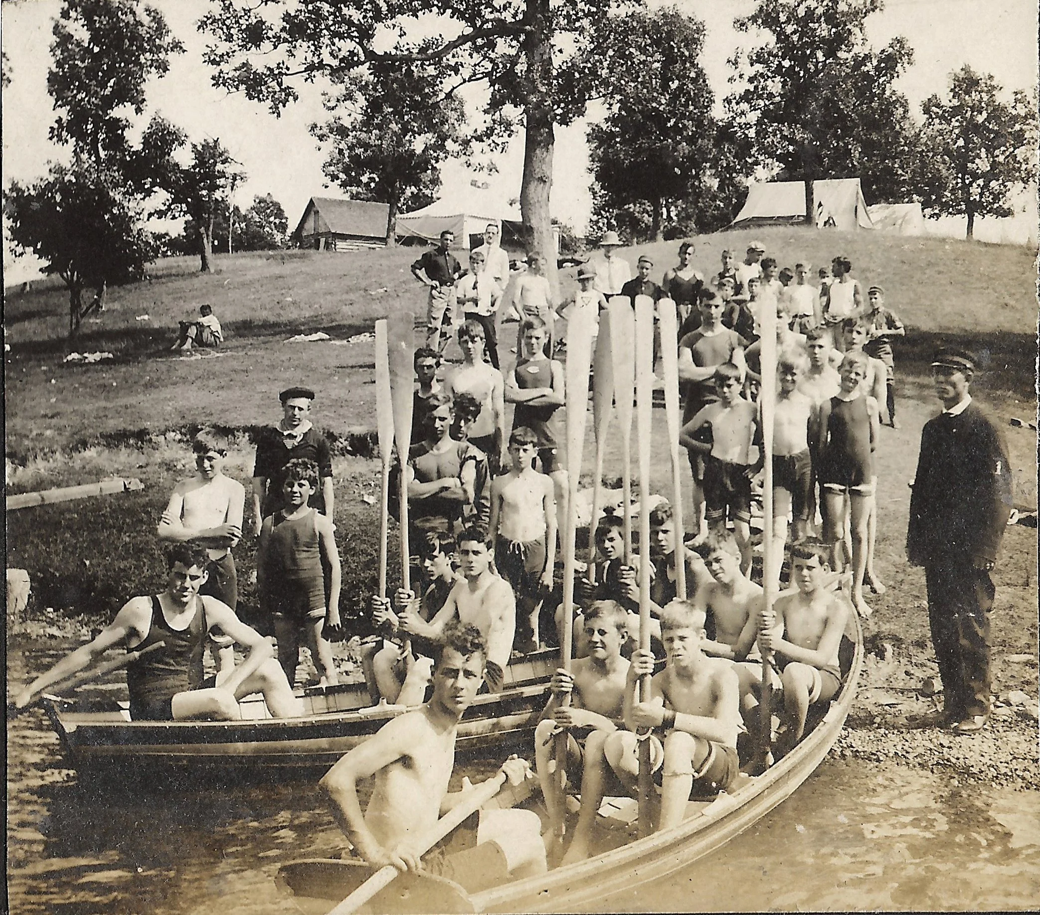 1900s - Campers in canoes with their paddles