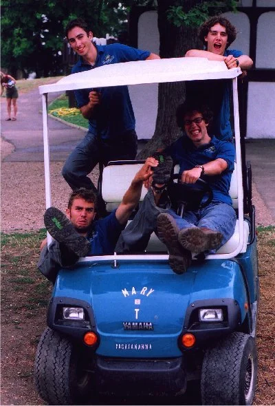 2000s - Staff piled on the golf cart